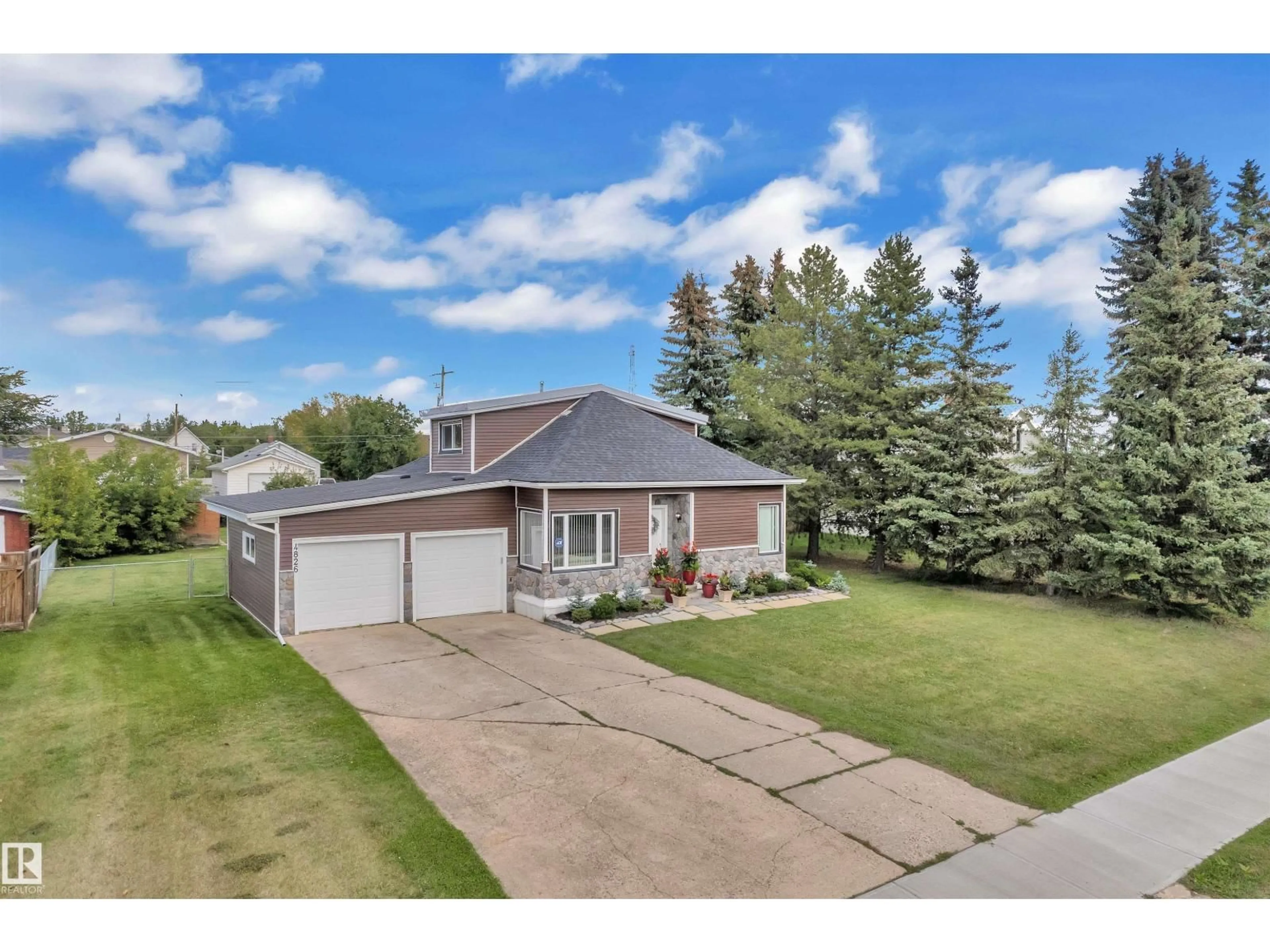 A pic from outside/outdoor area/front of a property/back of a property/a pic from drone, street for 4826 52 AV, Tofield Alberta T0B4J0