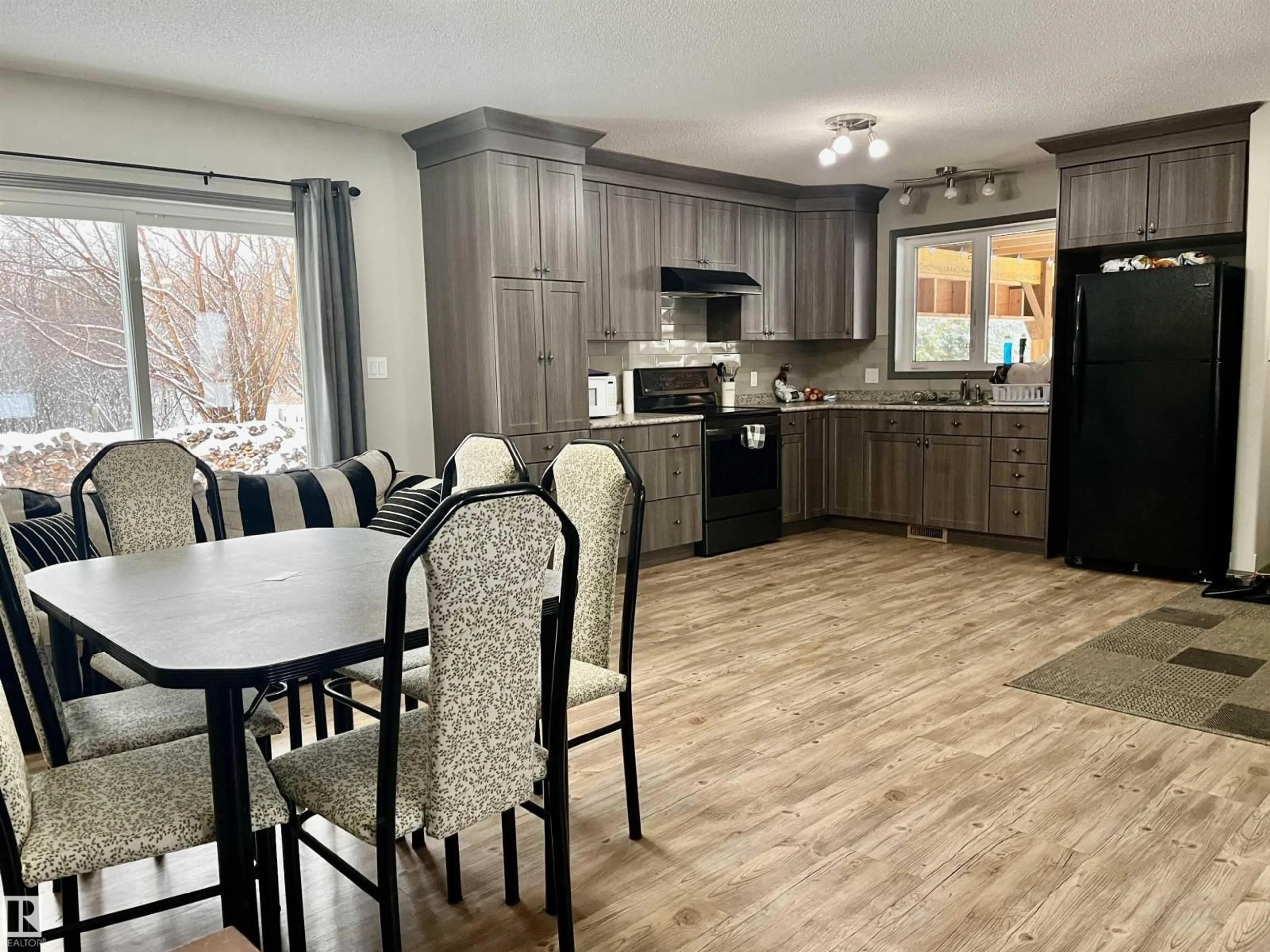 Open concept kitchen, wood/laminate floor for 5304 53 ST, Andrew Alberta T0B0C0
