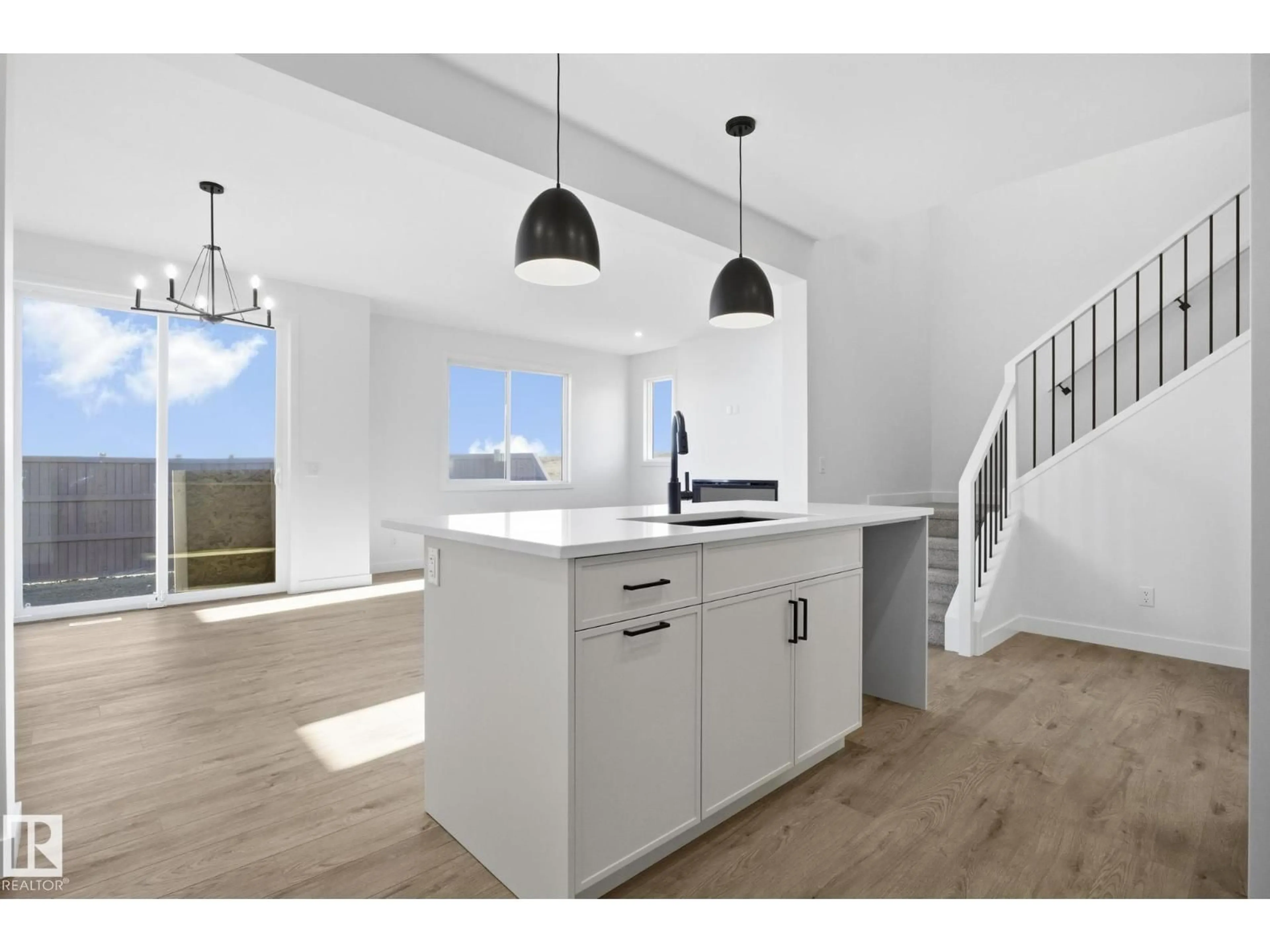 Open concept kitchen, wood/laminate floor for 311 PATERSON LI SW, Edmonton Alberta T6W5K8