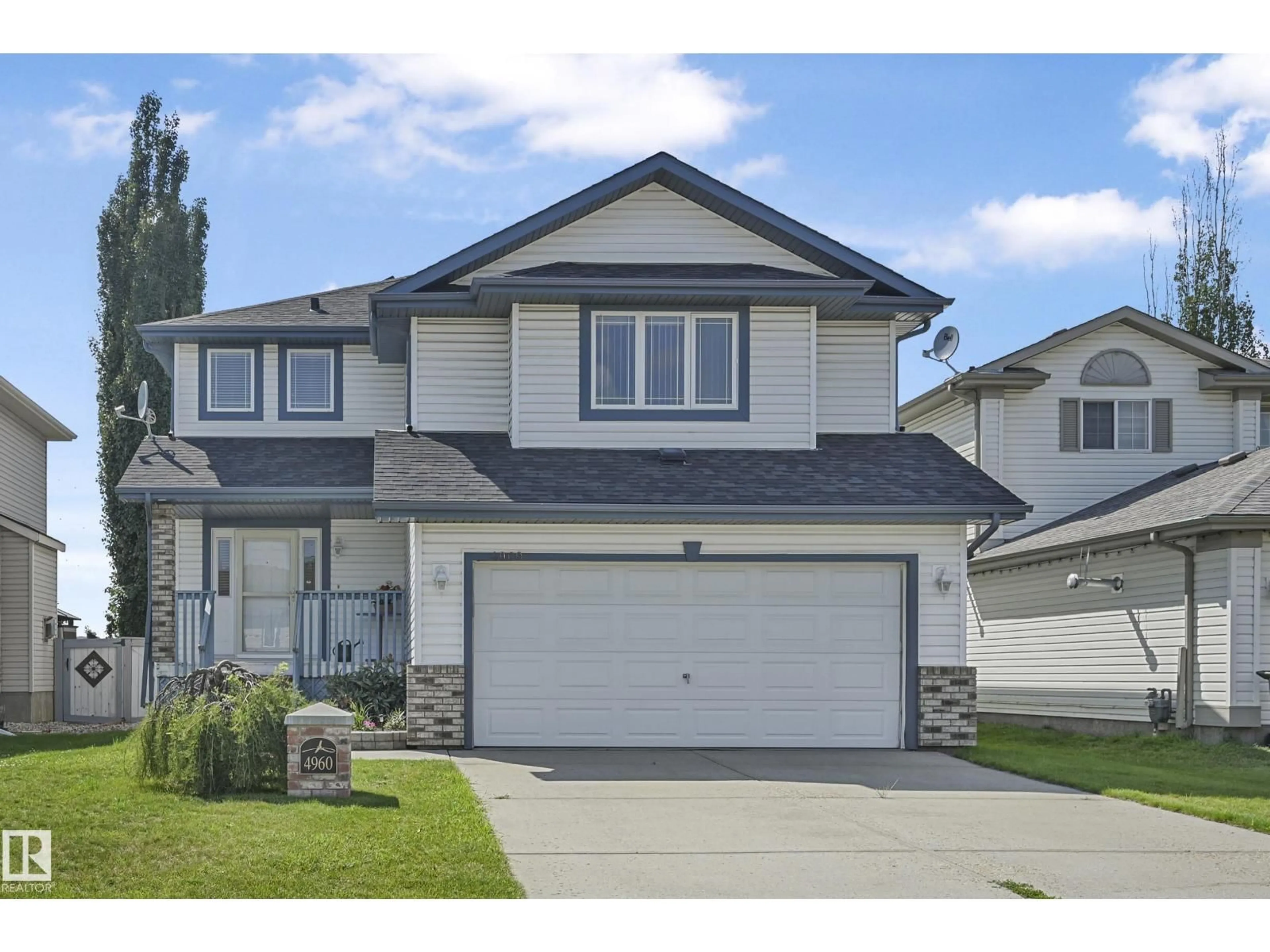 Home with vinyl exterior material, street for 4960 191 ST NW, Edmonton Alberta T8M2T8