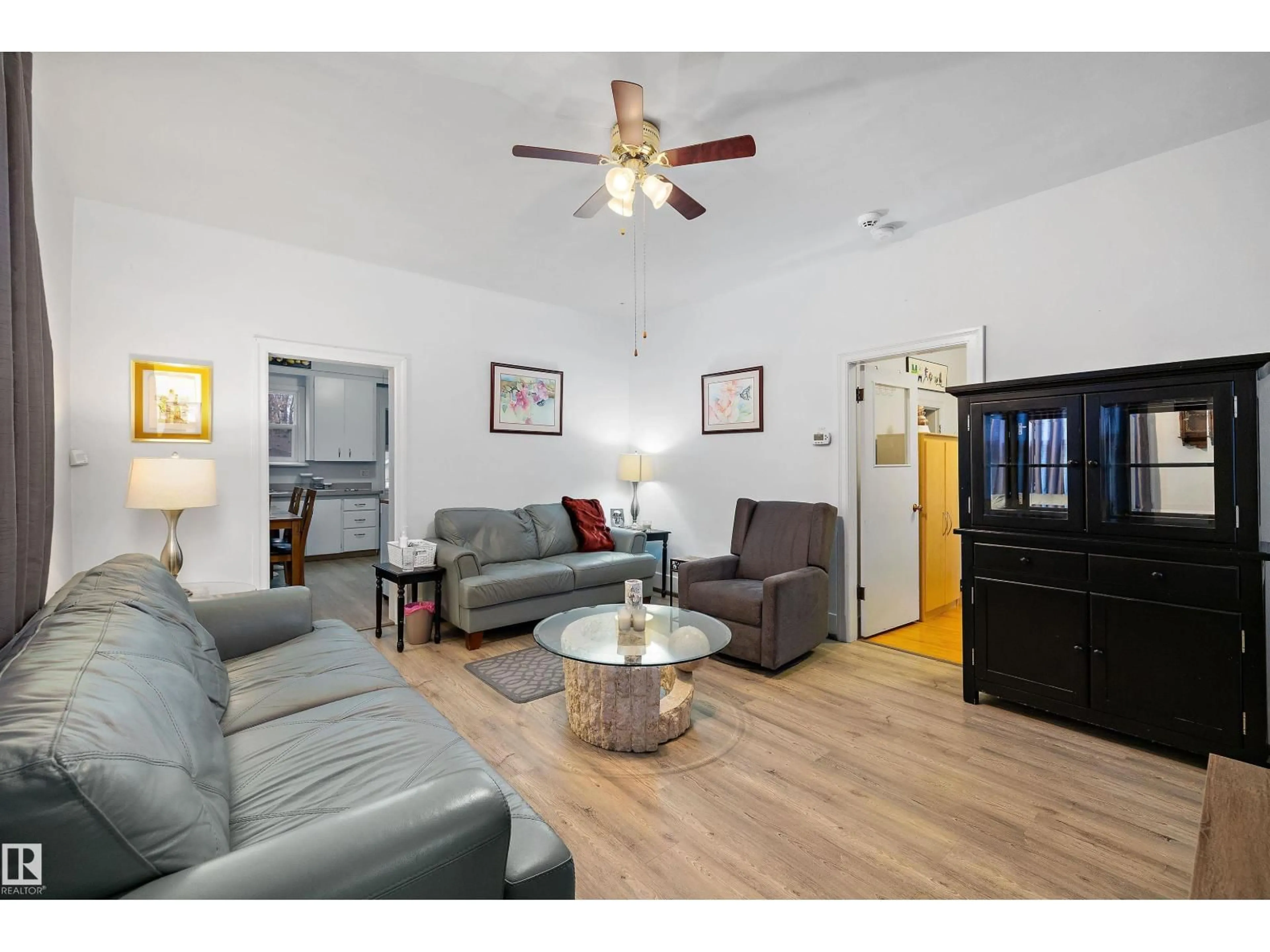 Living room with furniture, wood/laminate floor for NW - 11828 50 ST, Edmonton Alberta T5W3B9