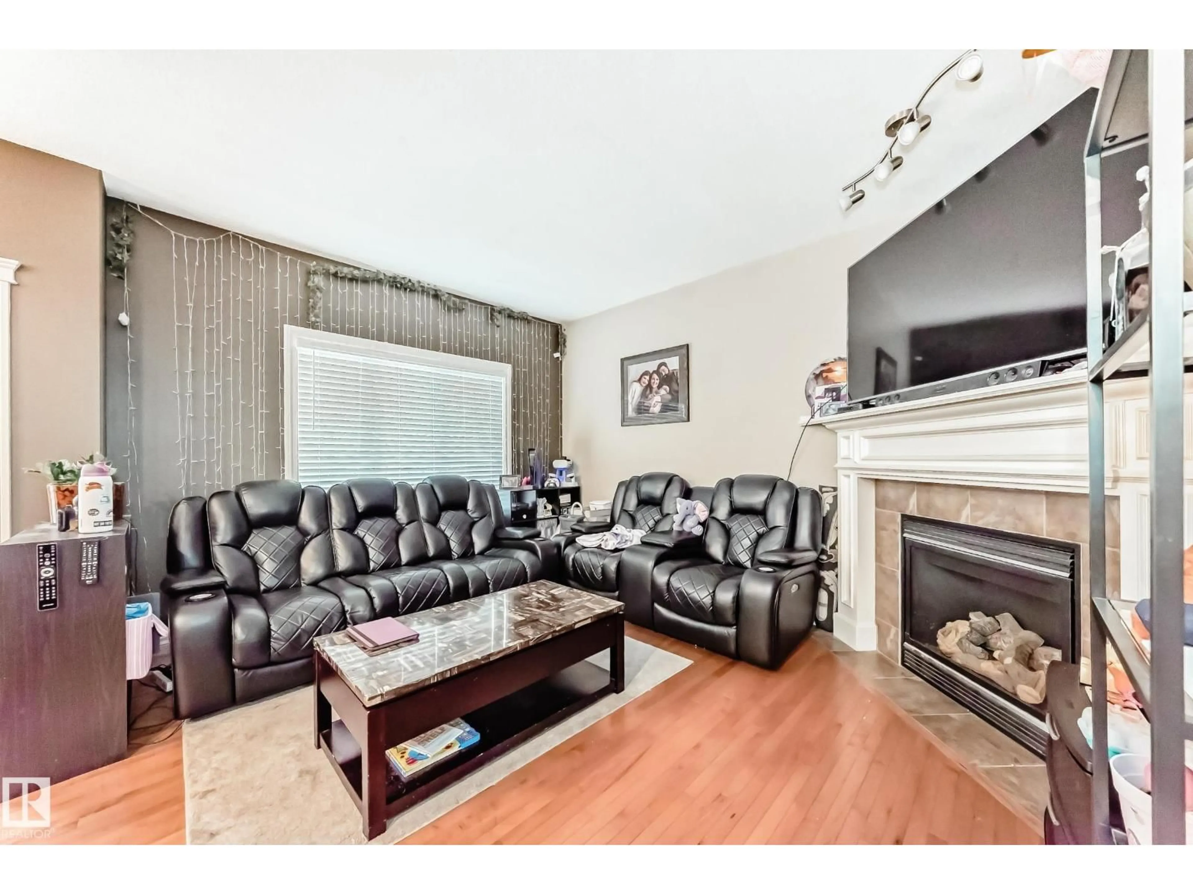 Living room with furniture, wood/laminate floor for 26 HENDERSON CO, Spruce Grove Alberta T7X0C6