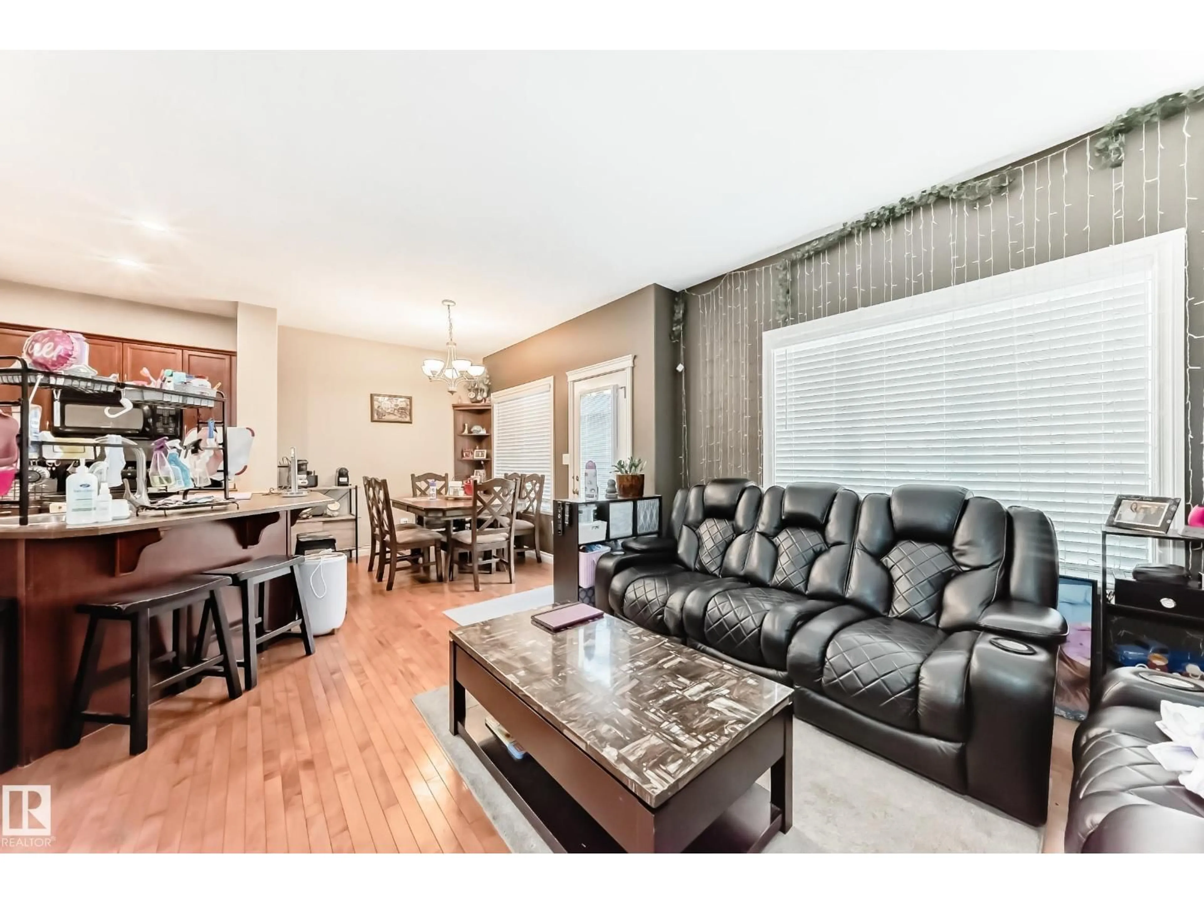 Living room with furniture, wood/laminate floor for 26 HENDERSON CO, Spruce Grove Alberta T7X0C6