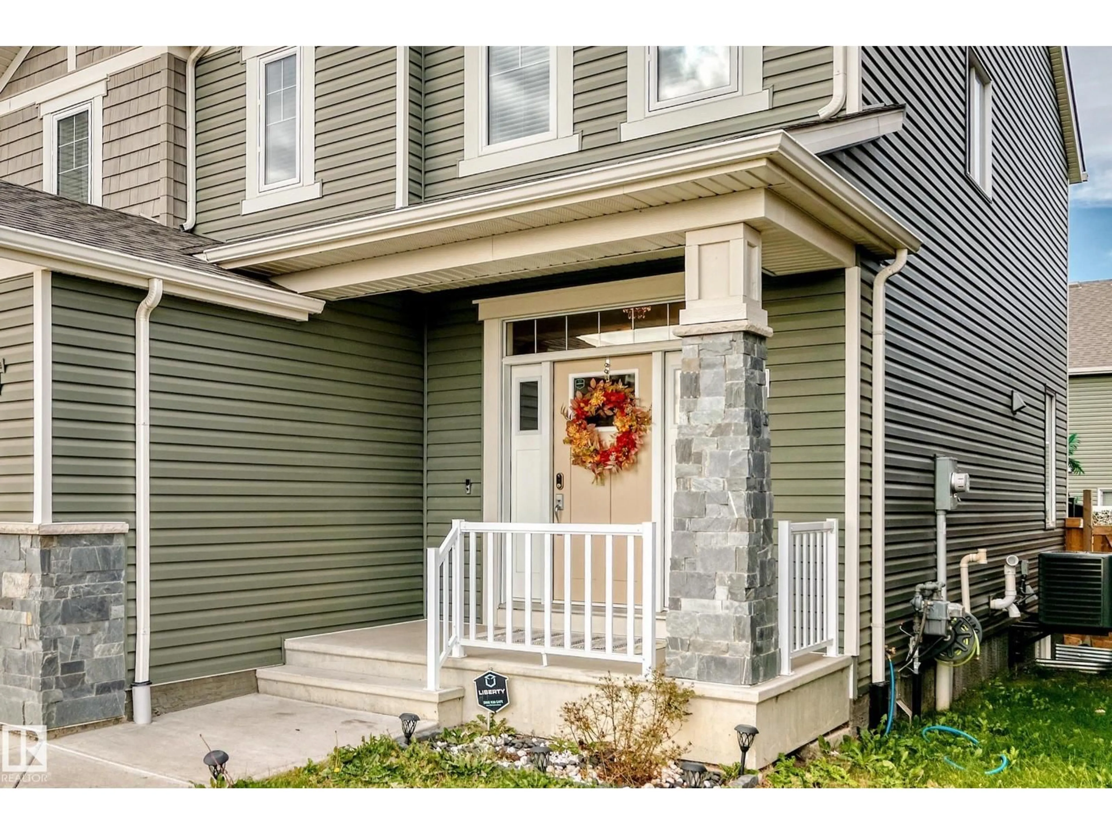 Home with vinyl exterior material, street for NW - 2012 200 ST, Edmonton Alberta T6M0X7