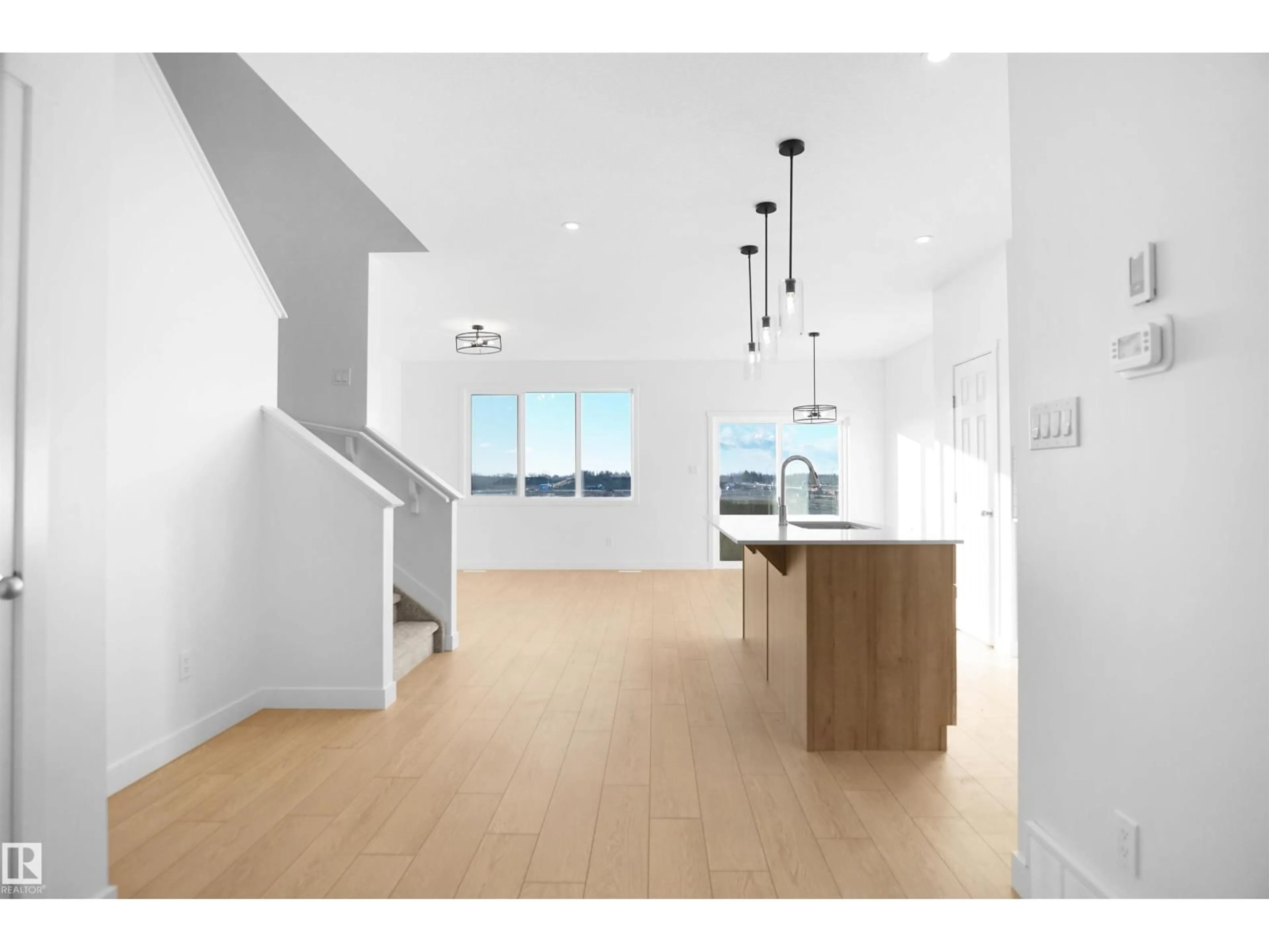 Open concept kitchen, wood/laminate floor for NW - 13136 214 ST, Edmonton Alberta T5S0X1