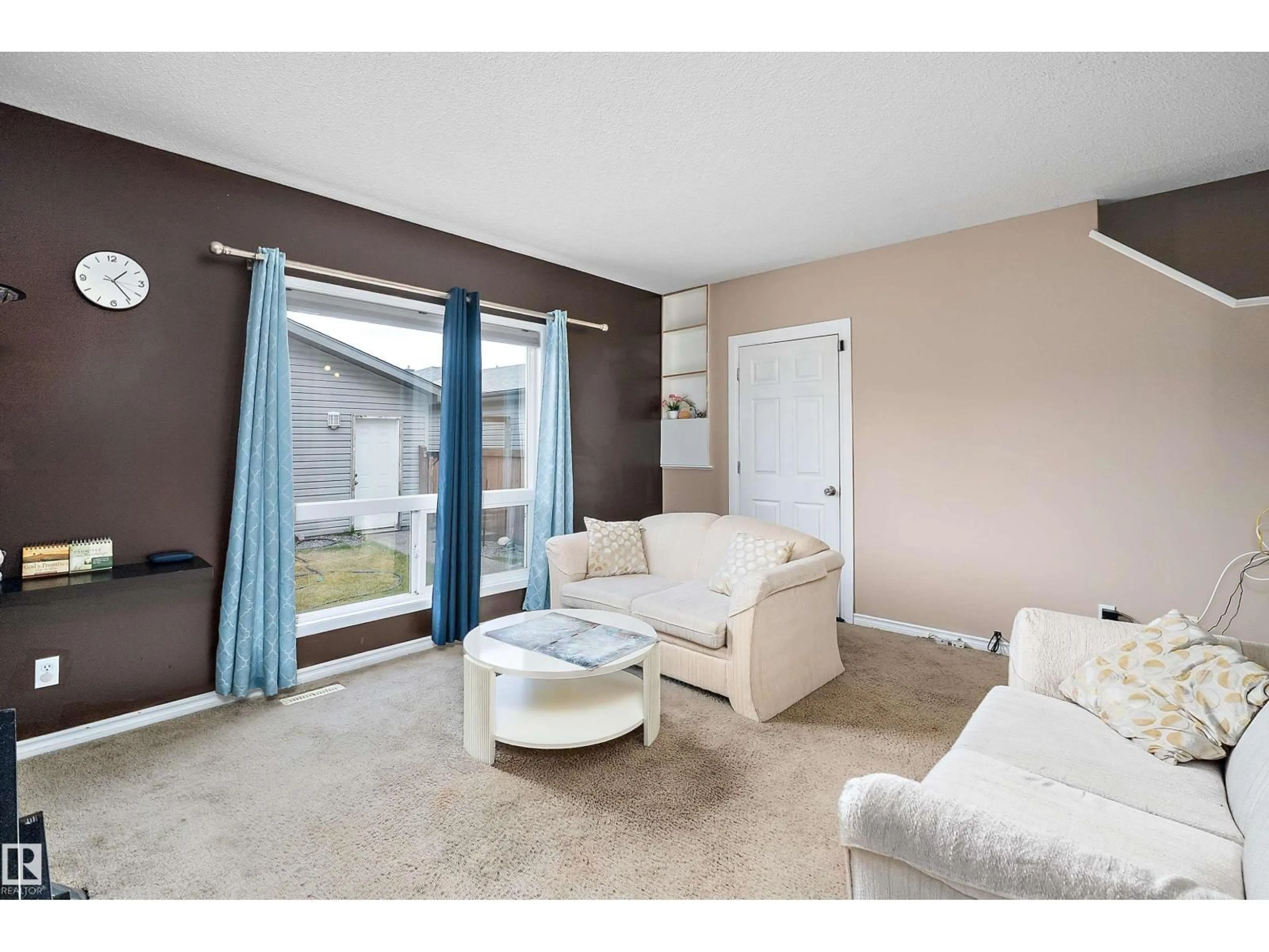 Living room with furniture, unknown for 4208 161 AV, Edmonton Alberta T5Y0G5