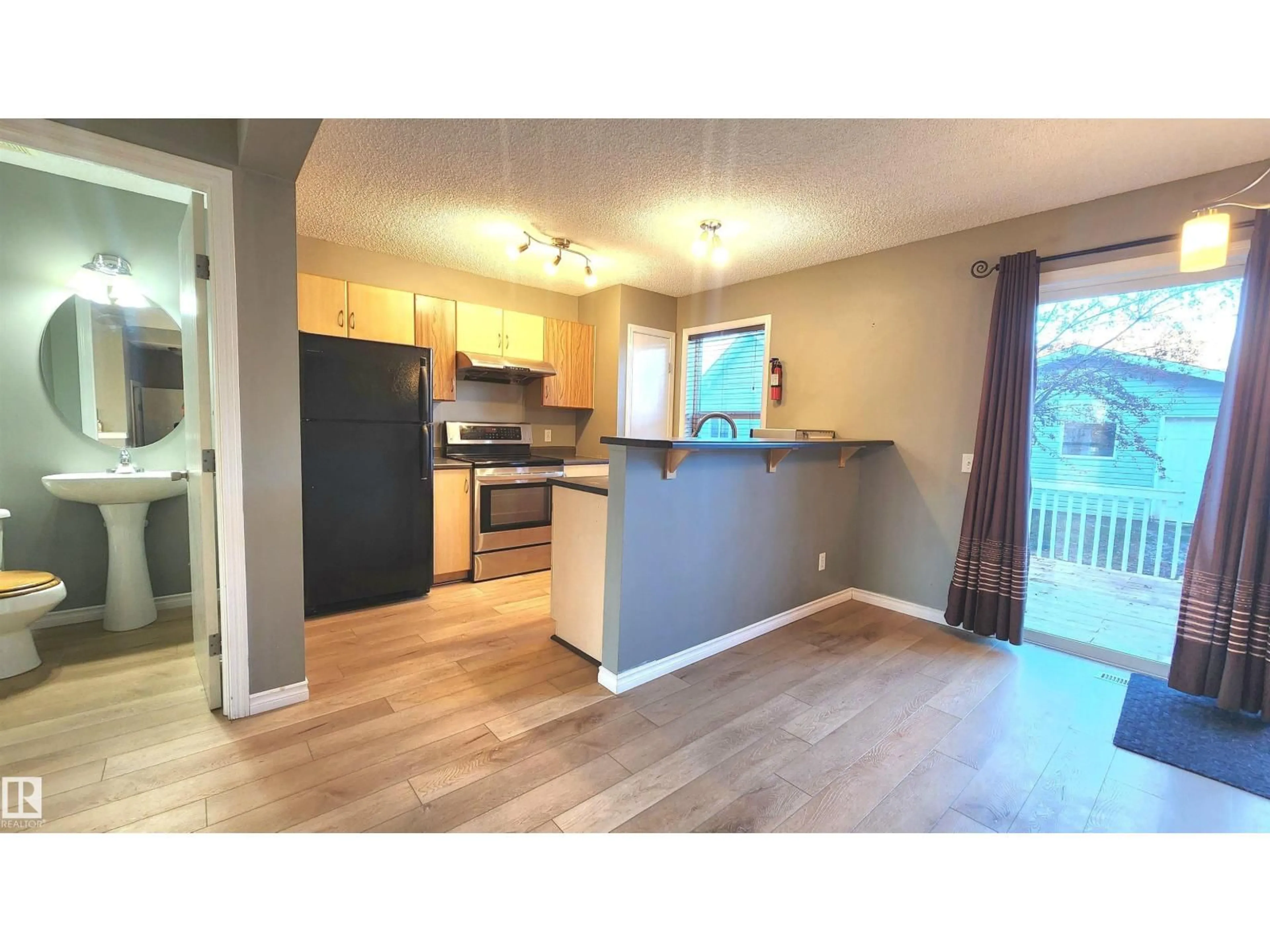 Open concept kitchen, wood/laminate floor for 5063 STANTON DR, Edmonton Alberta T6X1E8
