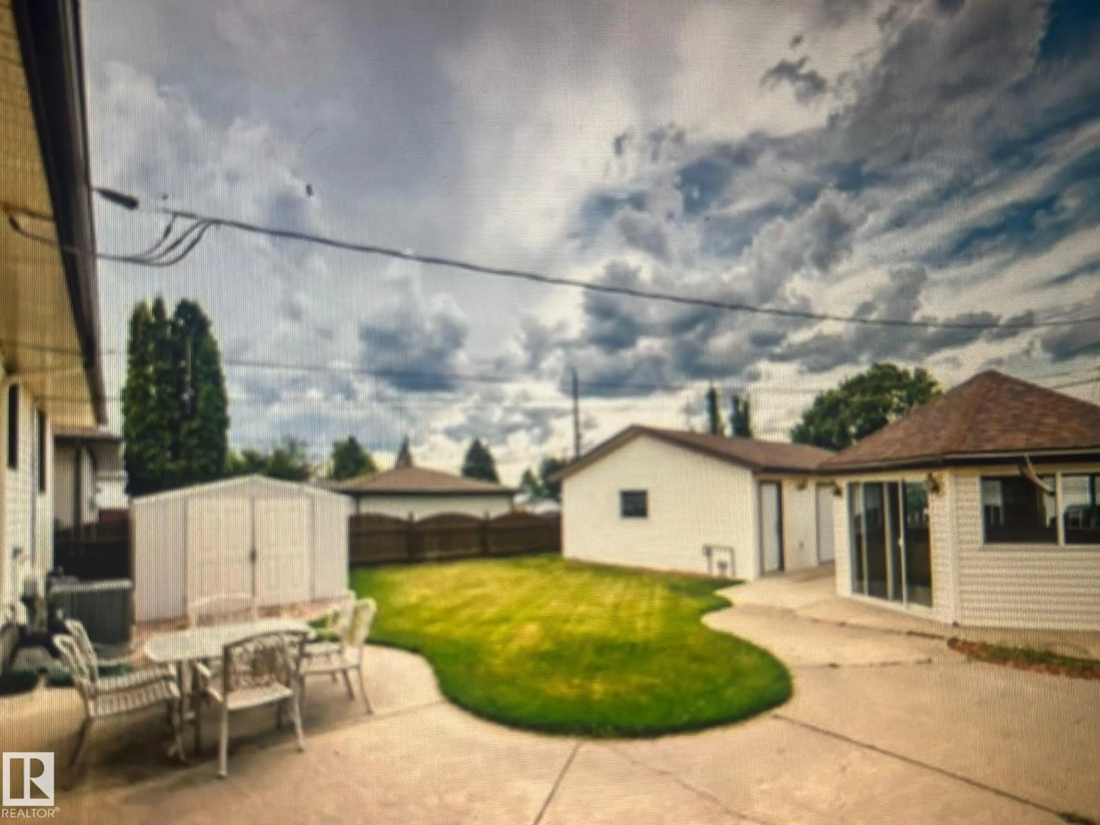 A pic from outside/outdoor area/front of a property/back of a property/a pic from drone, street for 7112 99 AVENUE, Edmonton Alberta T6A0E1