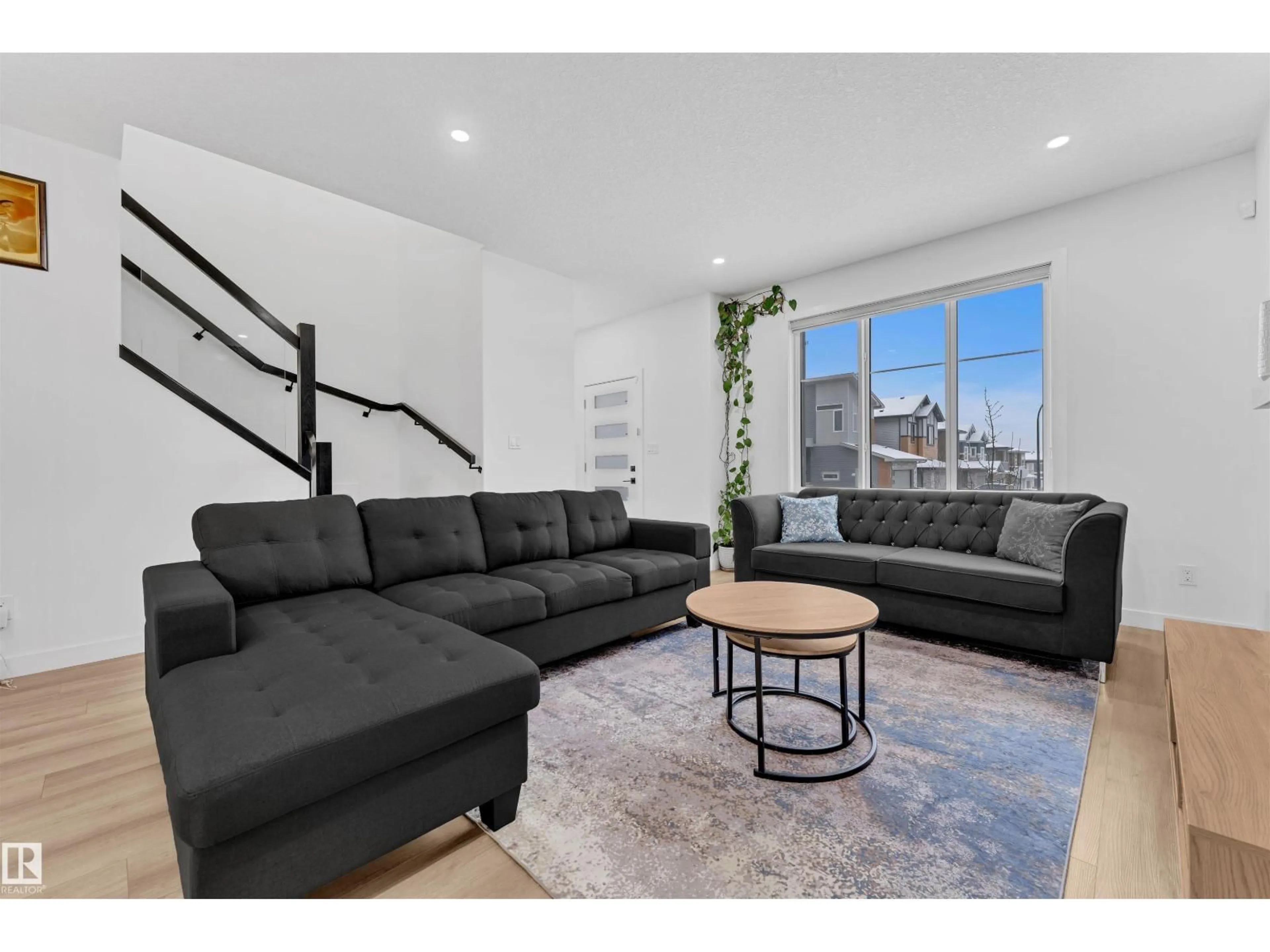 Living room with furniture, unknown for 217 CHARLESWORTH DR, Edmonton Alberta T6X2W2