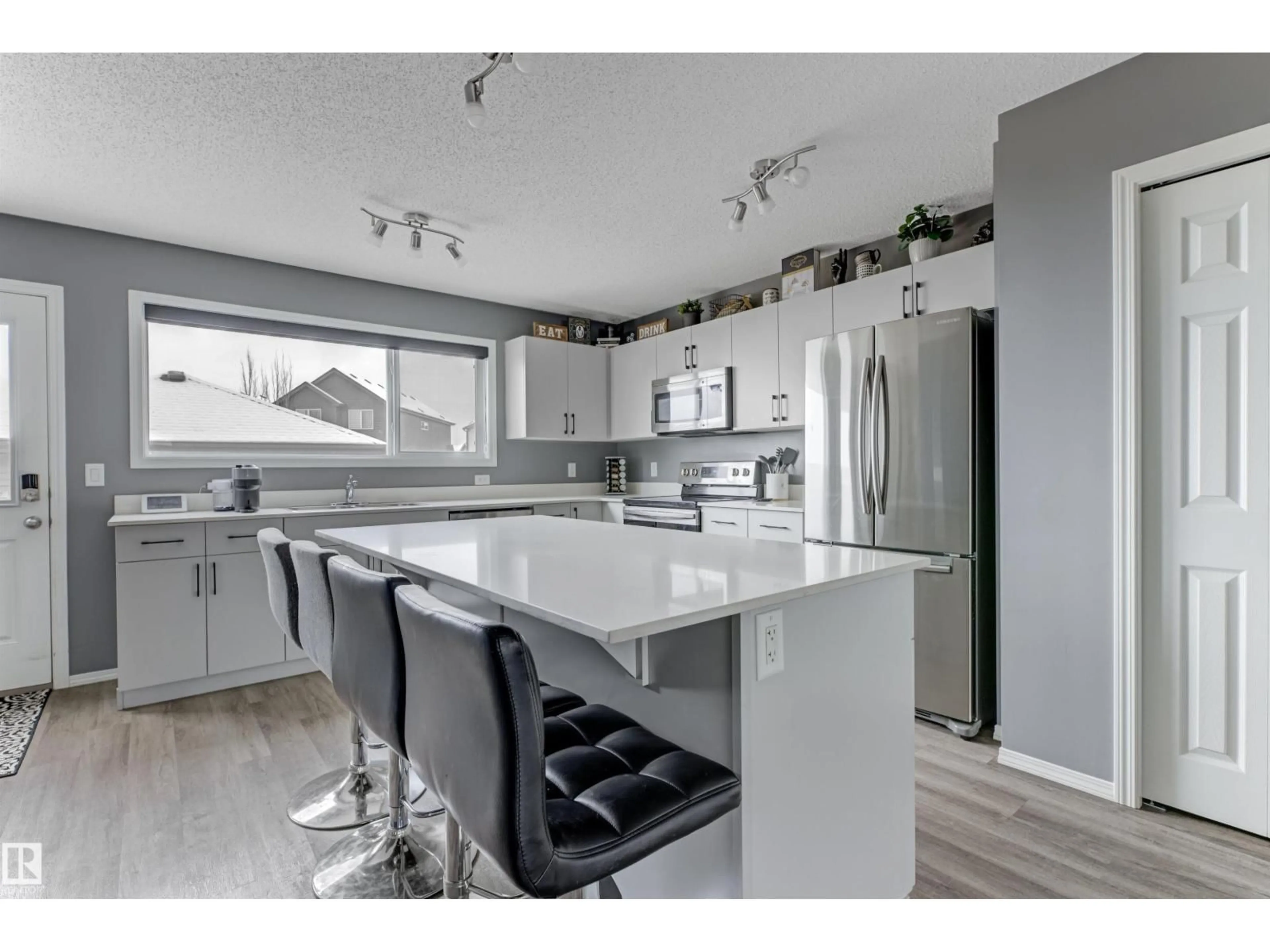 Open concept kitchen, wood/laminate floor for 2095 GRAYDON HILL CR, Edmonton Alberta T6W4C7