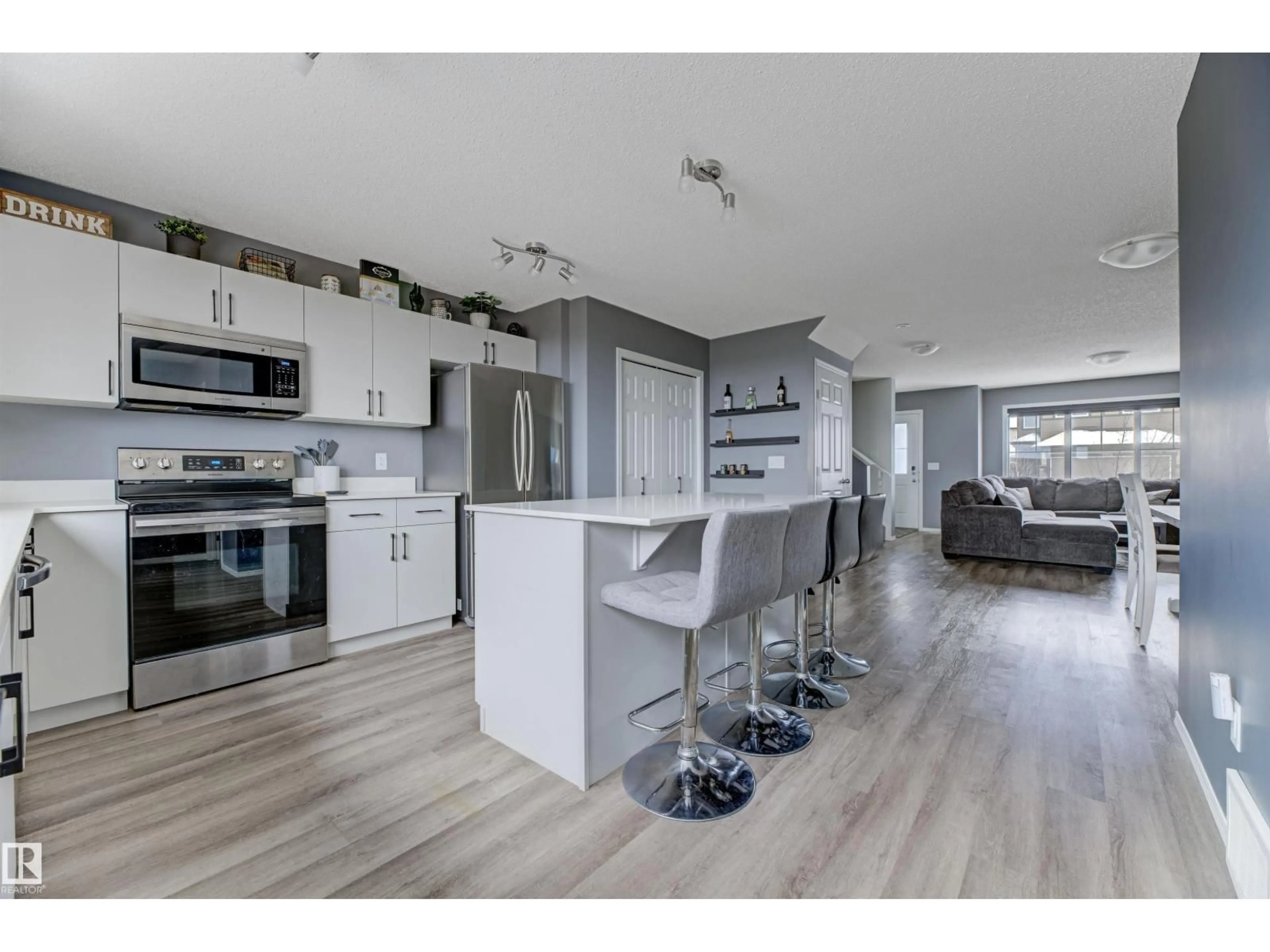 Open concept kitchen, wood/laminate floor for 2095 GRAYDON HILL CR, Edmonton Alberta T6W4C7