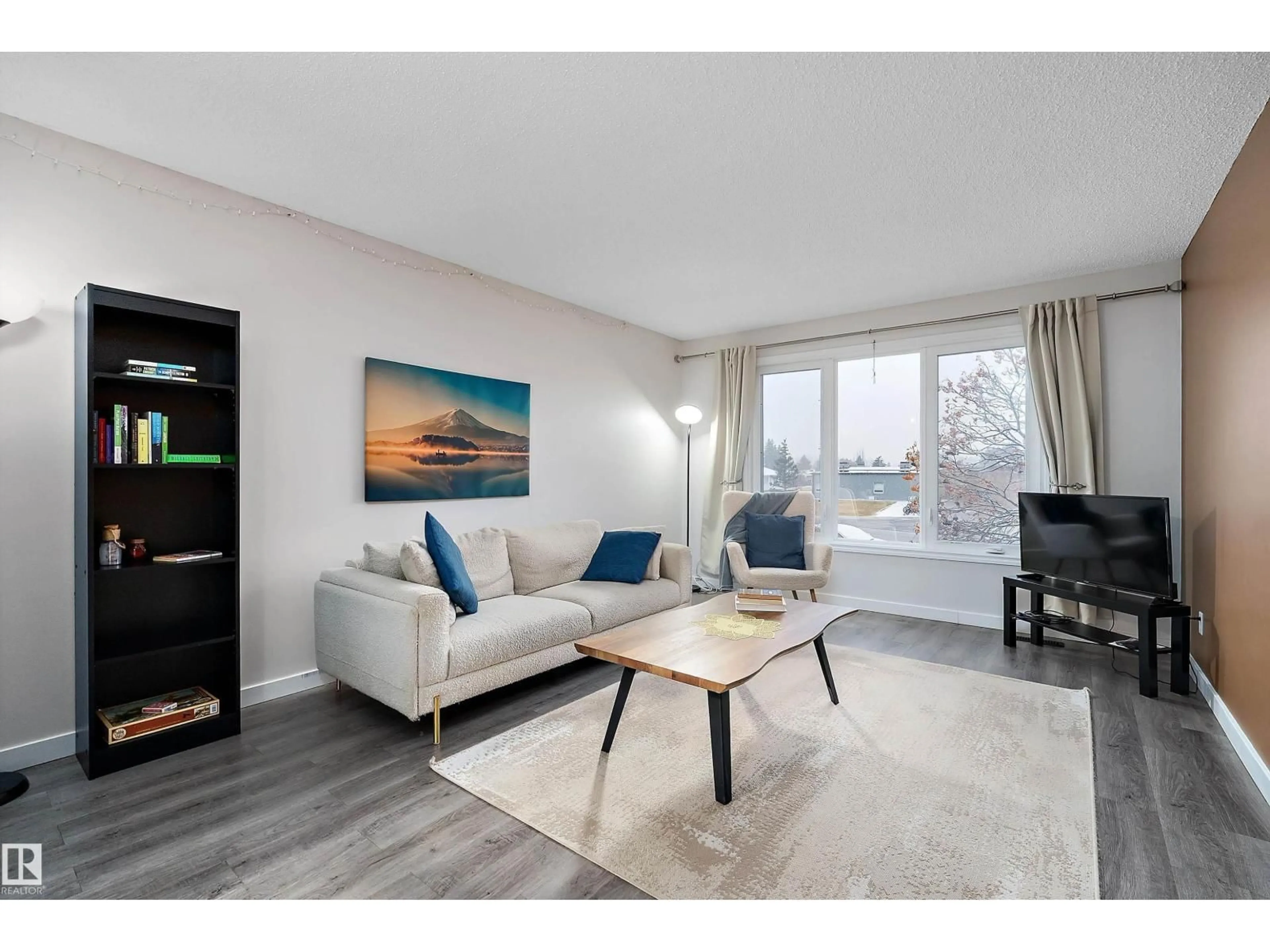 Living room with furniture, wood/laminate floor for 4317 44 ST, Beaumont Alberta T4X1G8