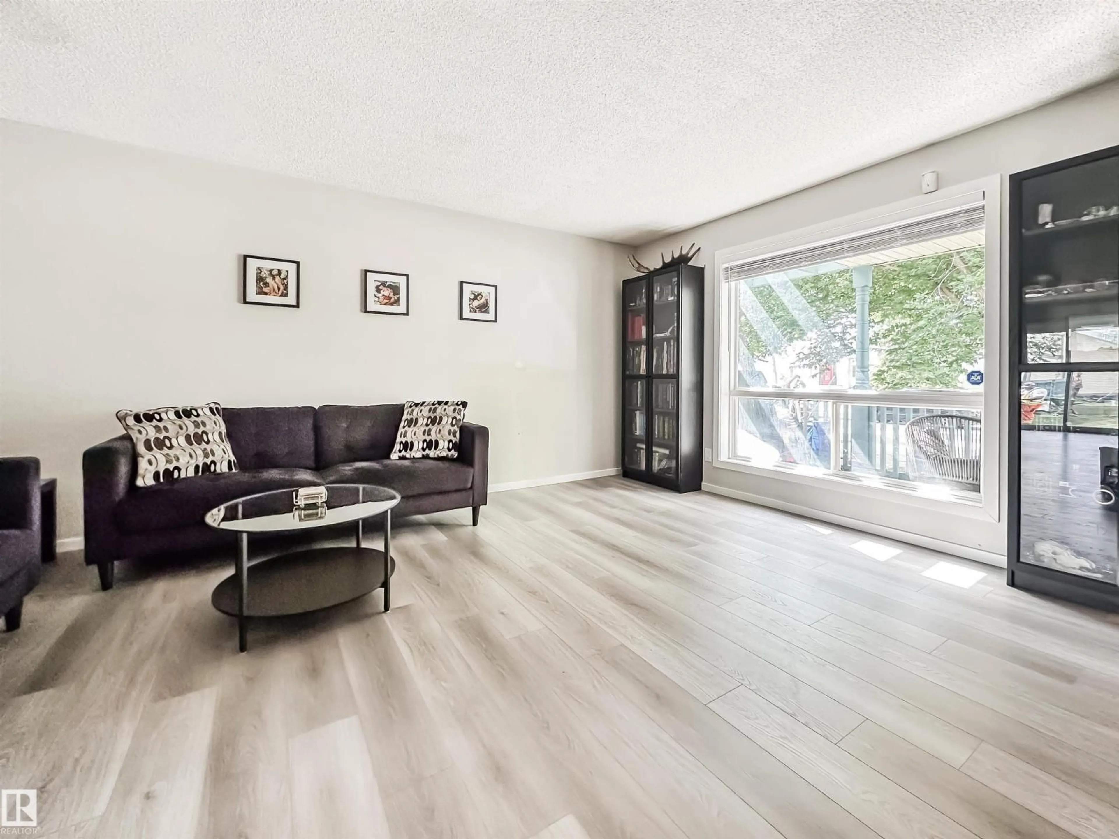 Living room with furniture, wood/laminate floor for #26 - 10909 106 ST NW, Edmonton Alberta T5H4M7