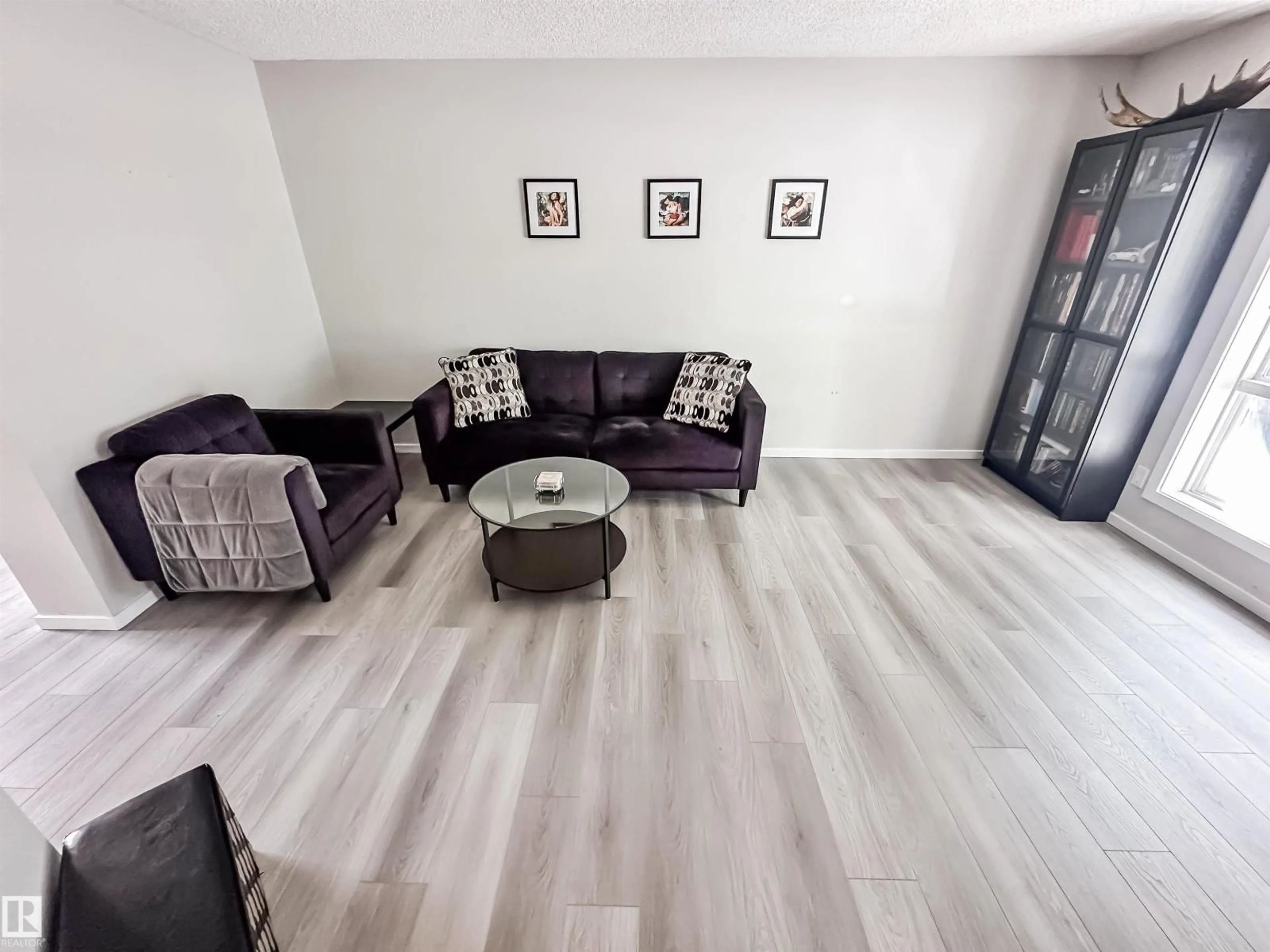 Living room with furniture, wood/laminate floor for #26 - 10909 106 ST NW, Edmonton Alberta T5H4M7