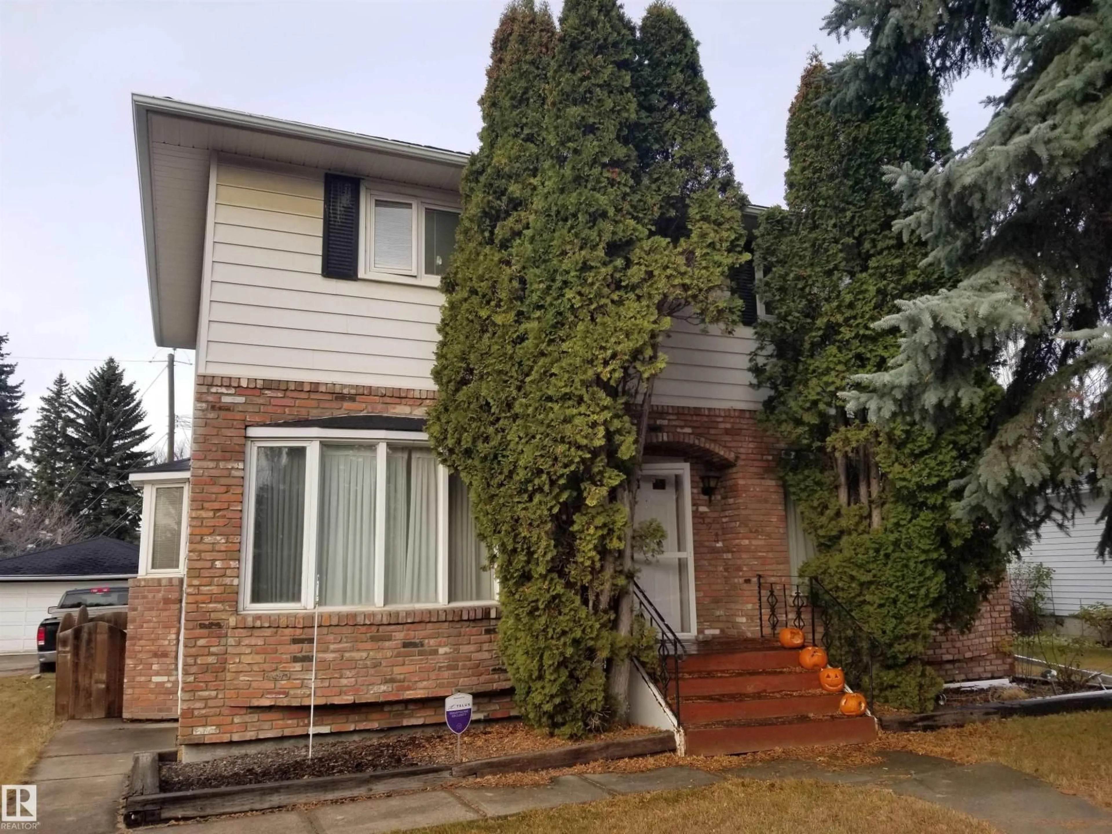 Home with brick exterior material, street for 7524 95 AV, Edmonton Alberta T6C1X5