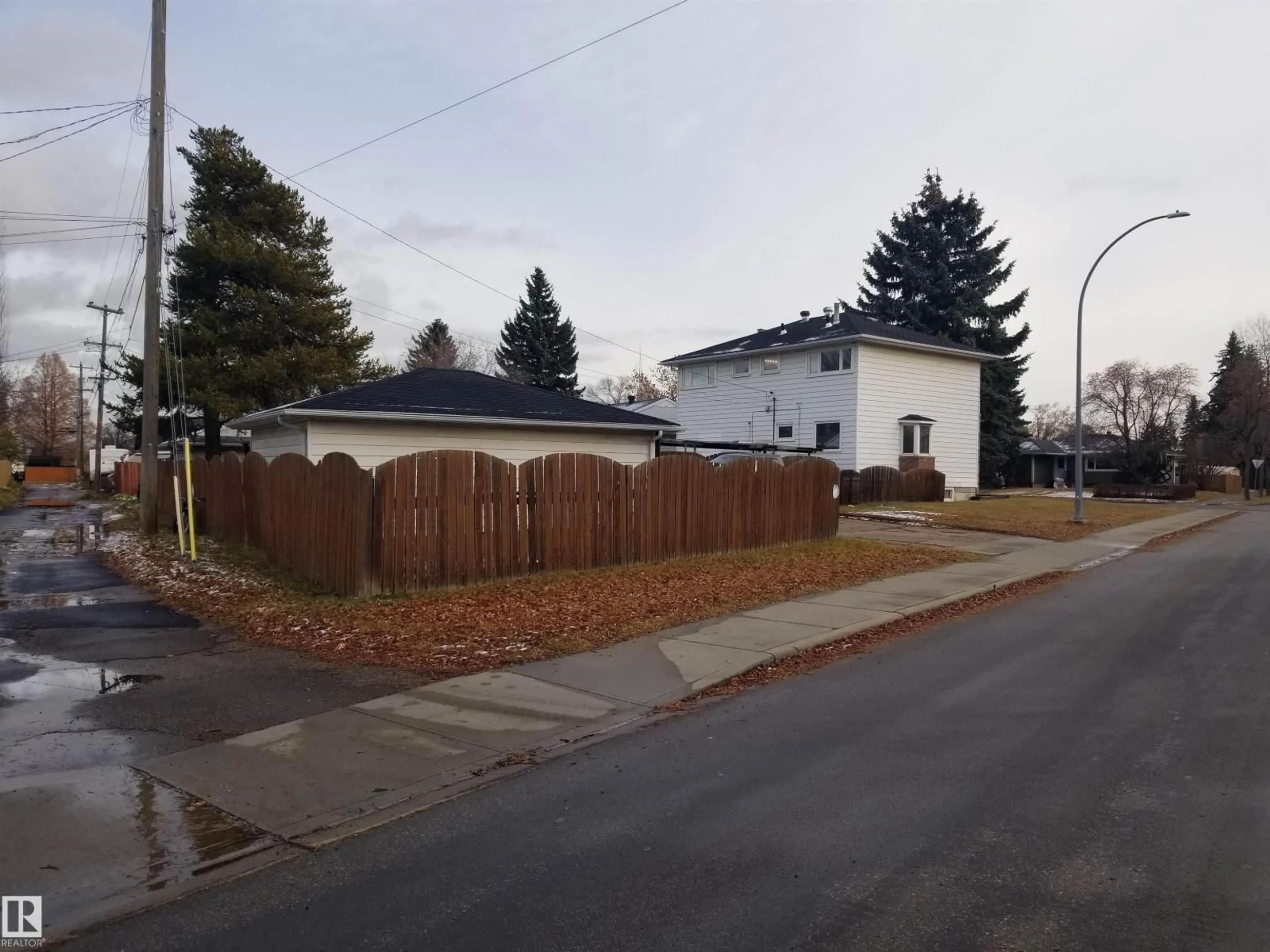 A pic from outside/outdoor area/front of a property/back of a property/a pic from drone, street for 7524 95 AV, Edmonton Alberta T6C1X5