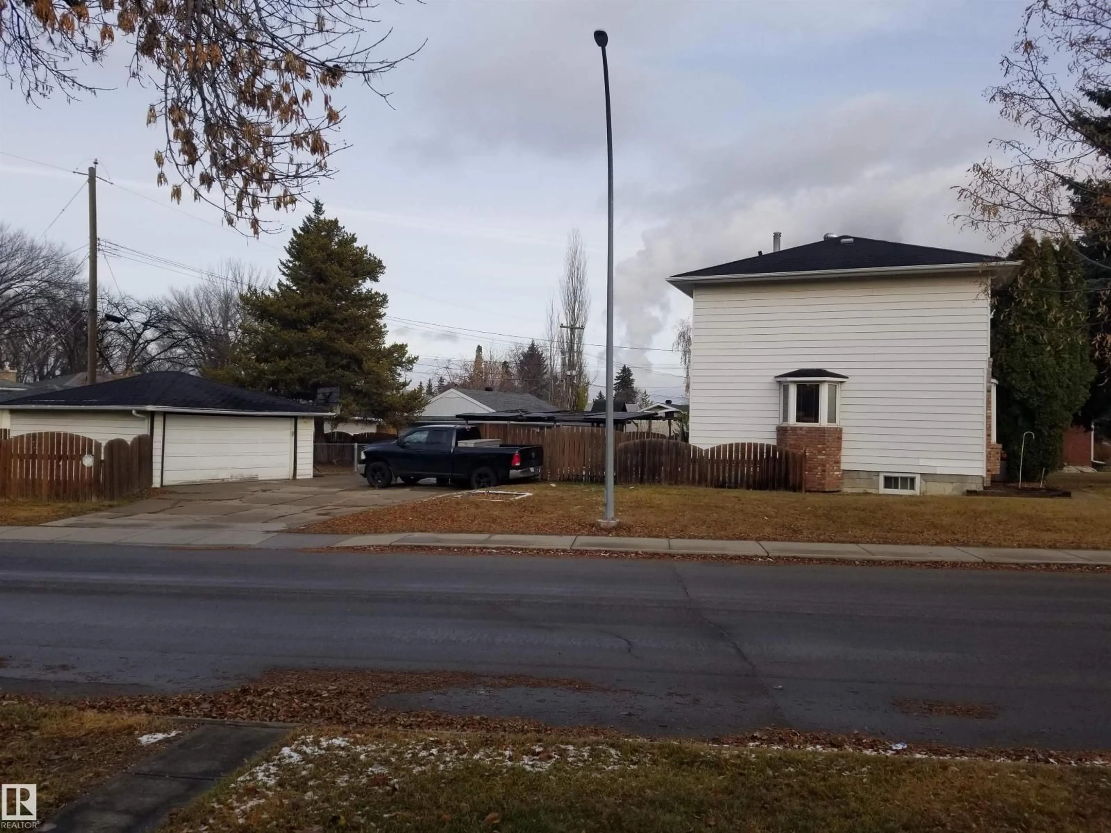 A pic from outside/outdoor area/front of a property/back of a property/a pic from drone, street for 7524 95 AV, Edmonton Alberta T6C1X5