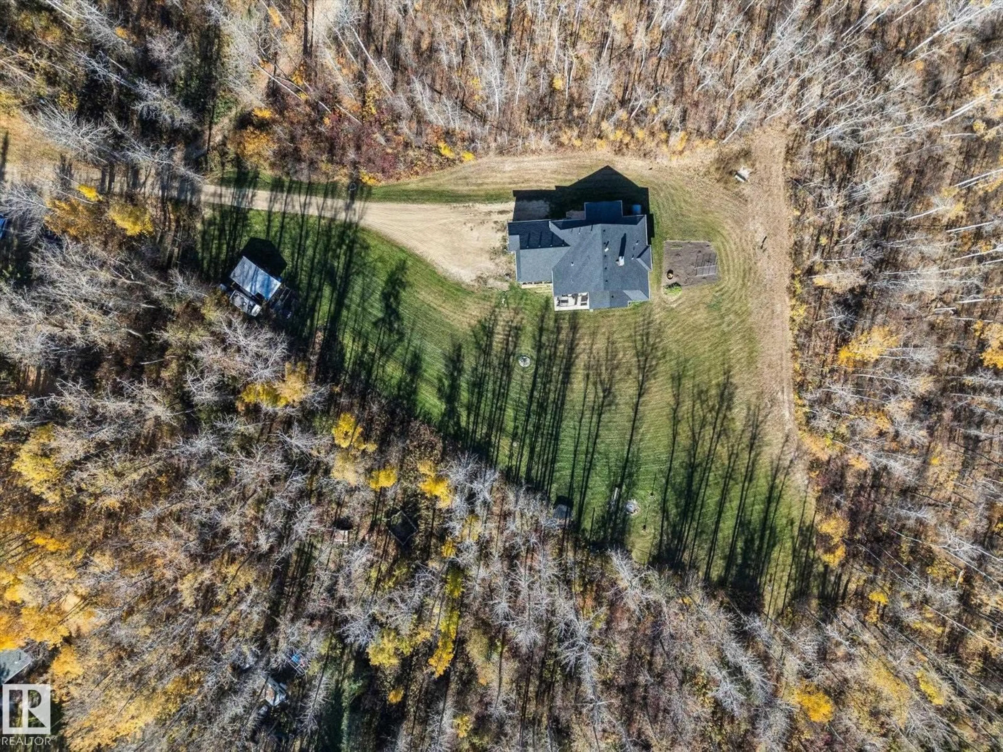 A pic from outside/outdoor area/front of a property/back of a property/a pic from drone, forest/trees view for 27 52228 RGE ROAD 30, Rural Parkland County Alberta T7Y2M5