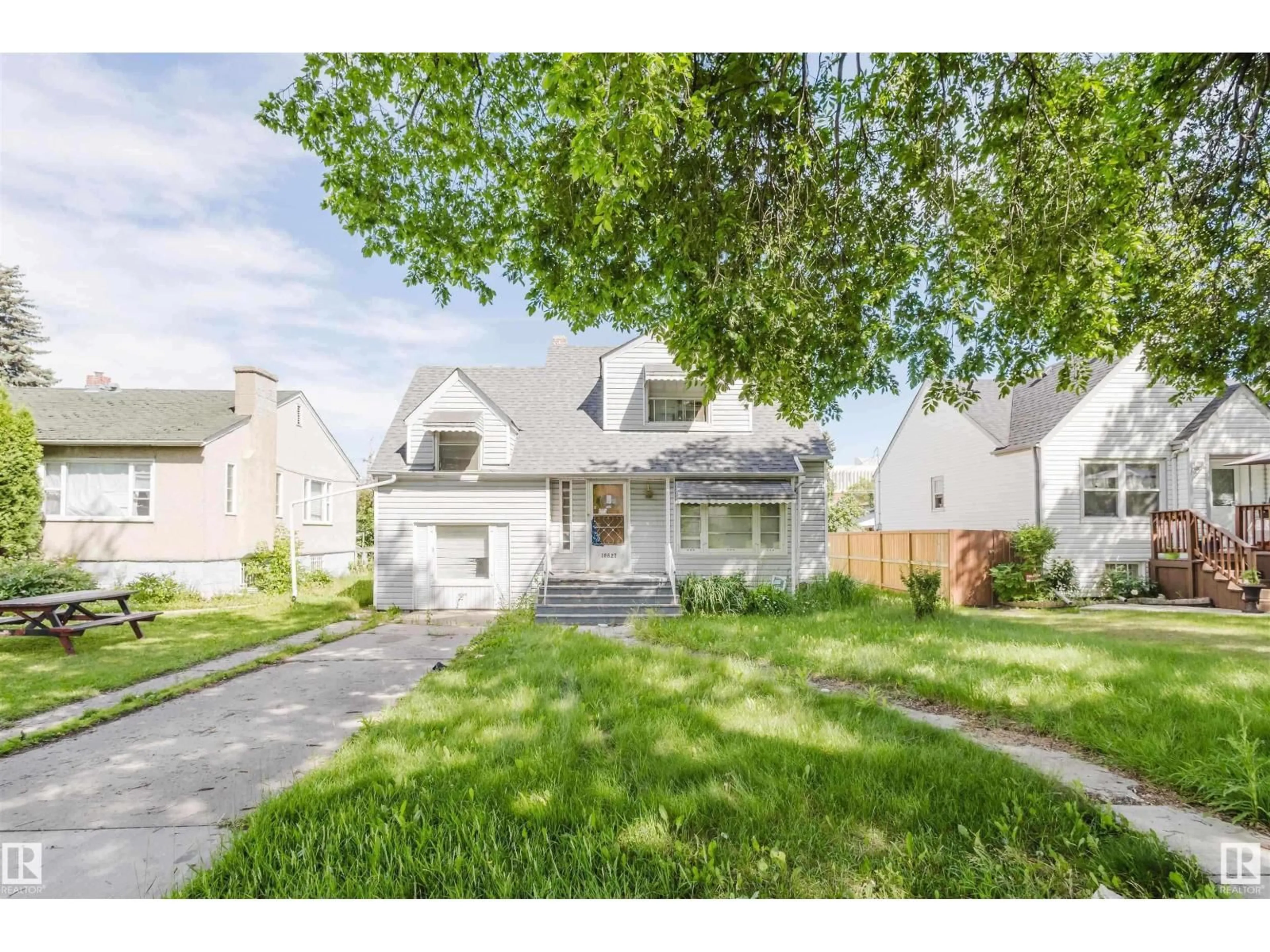 Home with vinyl exterior material, street for NW - 10827 111 ST, Edmonton Alberta T5H3G5