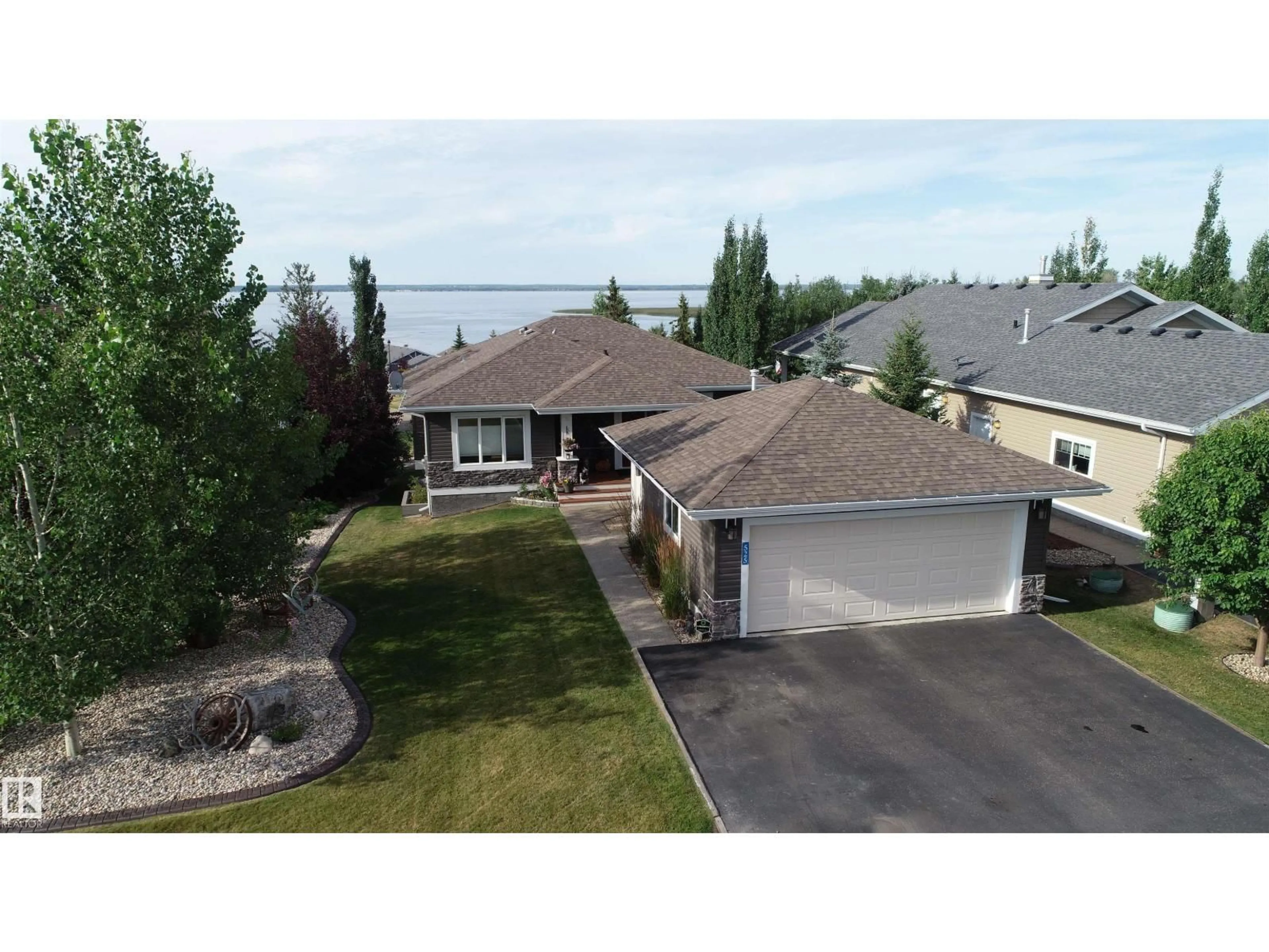A pic from outside/outdoor area/front of a property/back of a property/a pic from drone, street for 55101 STE. ANNE TR, Rural Lac Ste. Anne County Alberta T0E1A1