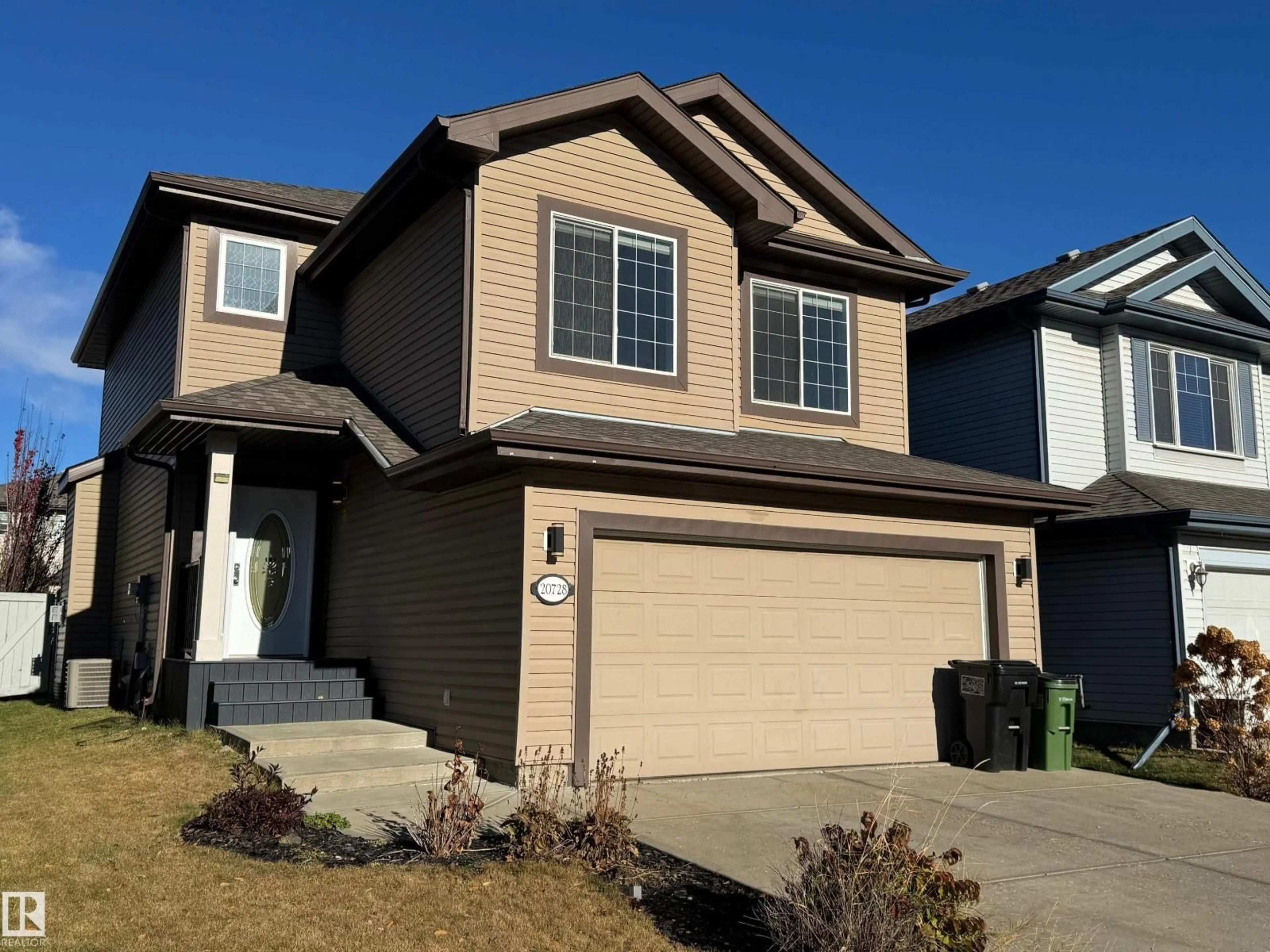 Home with vinyl exterior material, street for NW - 20728 55 AV, Edmonton Alberta T6M0B9