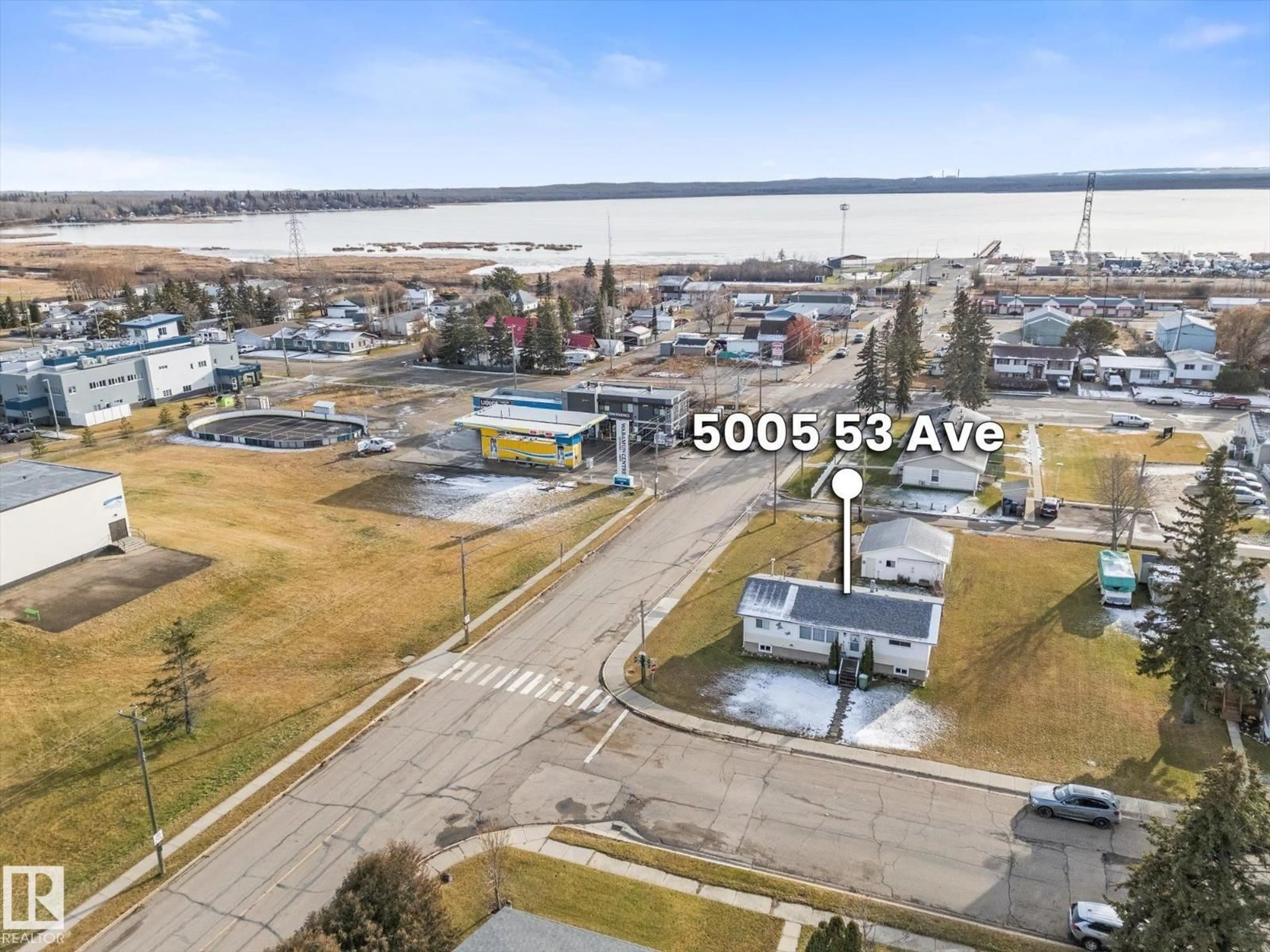 A pic from outside/outdoor area/front of a property/back of a property/a pic from drone, water/lake/river/ocean view for 5005 53 AV, Wabamun Alberta T0E2K0