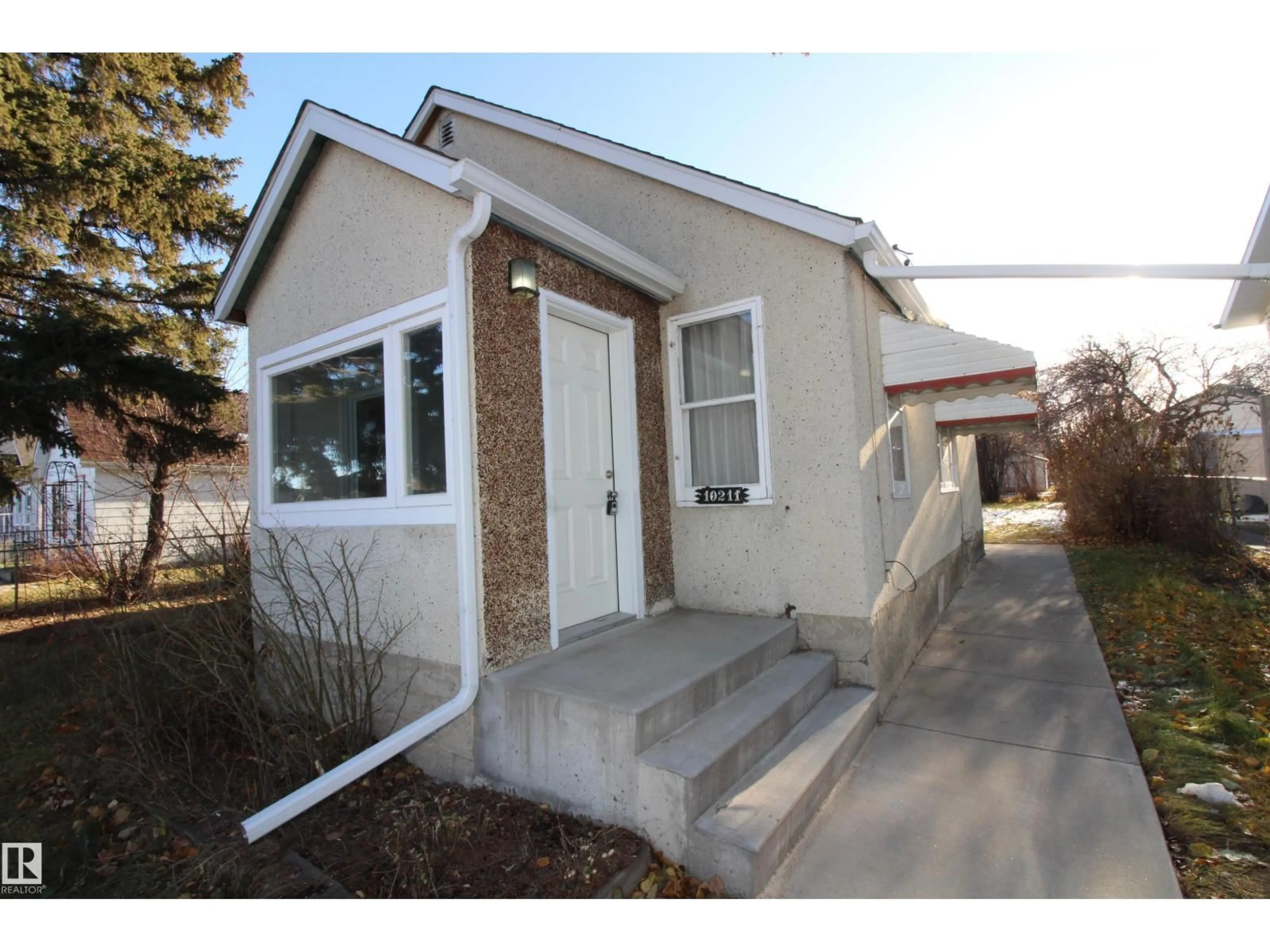 Home with vinyl exterior material, street for 10211 106 STREET, Westlock Alberta T7P1W4