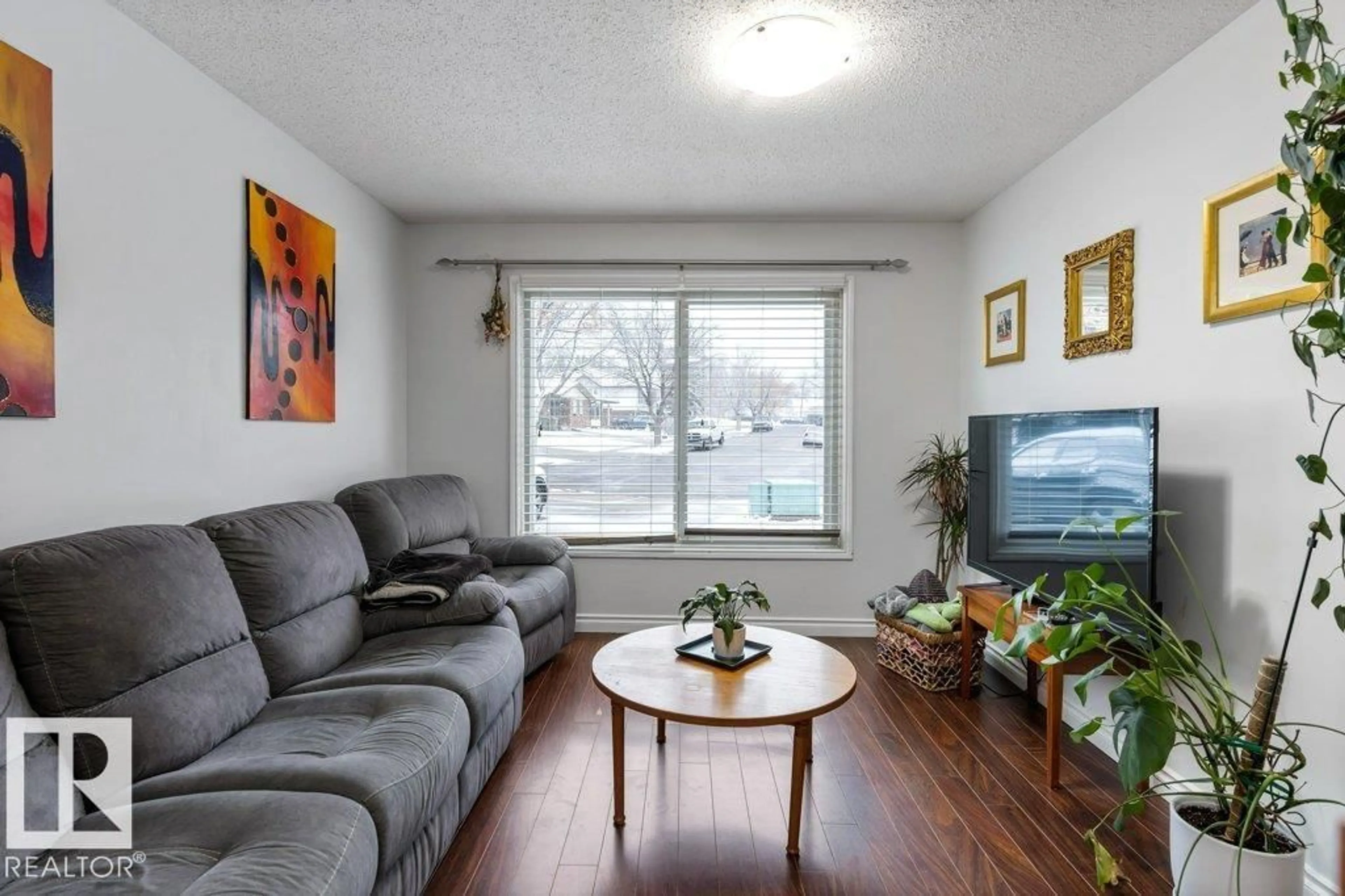 Living room with furniture, wood/laminate floor for 11 LOUISBOURG PL, St. Albert Alberta T8N4L4
