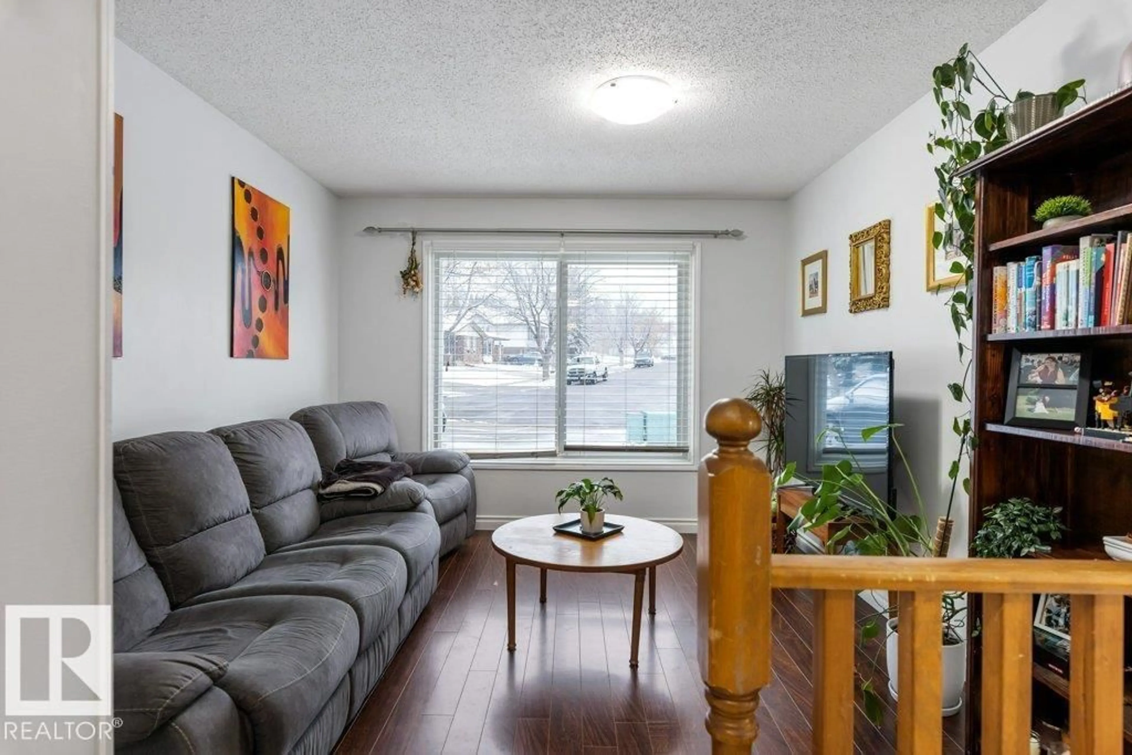 Living room with furniture, wood/laminate floor for 11 LOUISBOURG PL, St. Albert Alberta T8N4L4