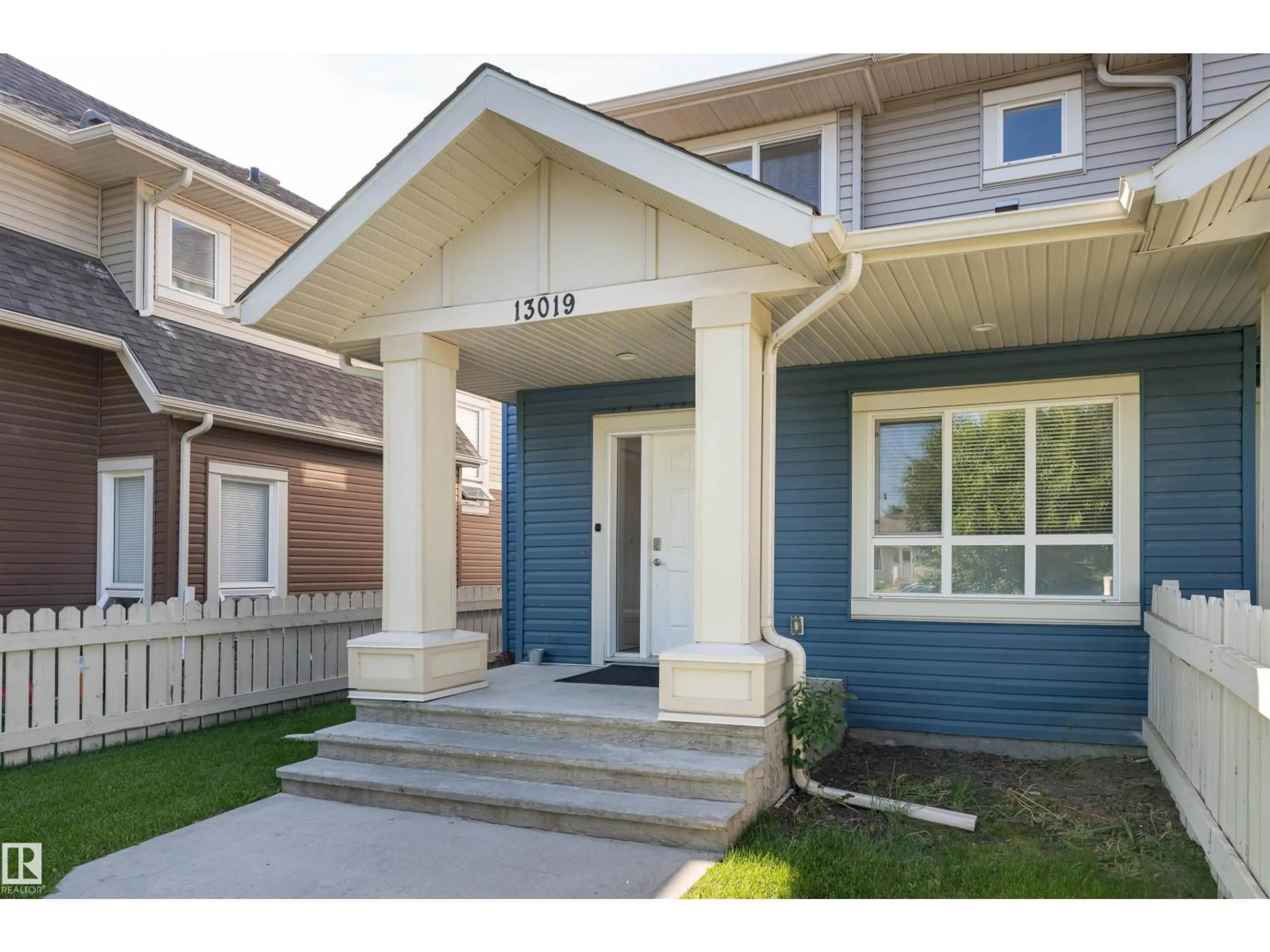 Home with vinyl exterior material, street for NW - 13019 132 AV, Edmonton Alberta T5L3R2