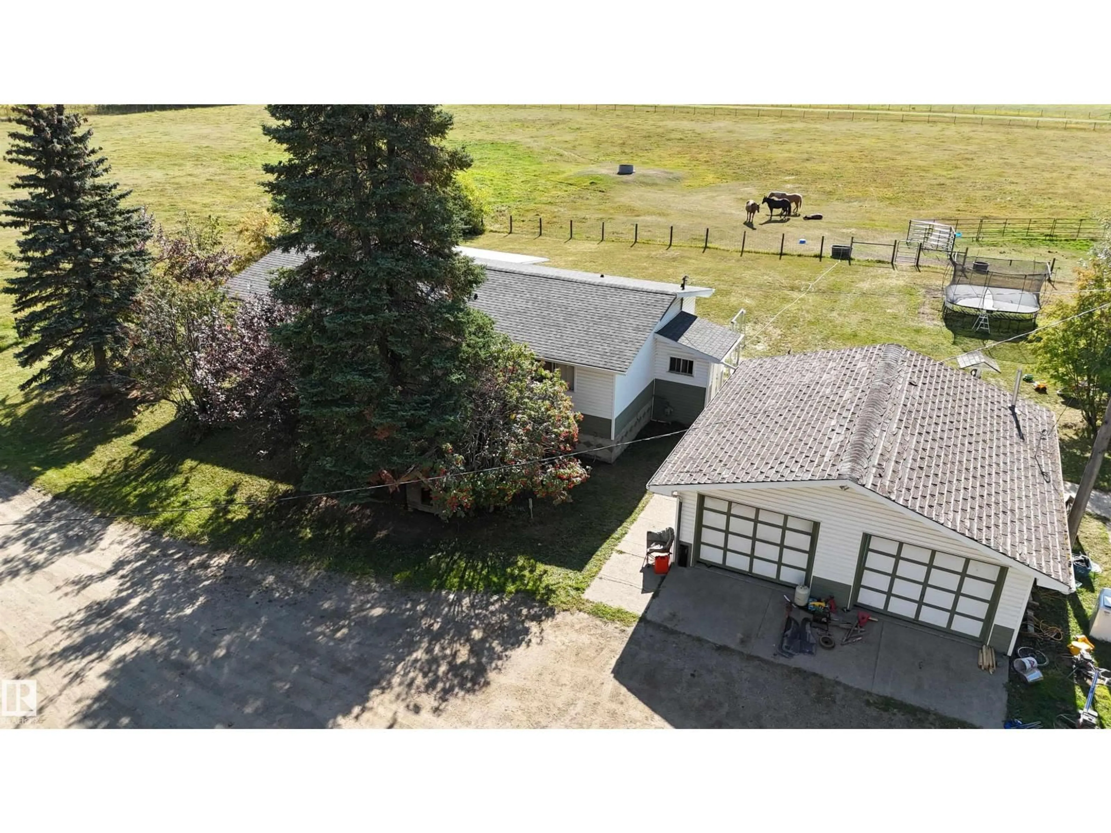 A pic from outside/outdoor area/front of a property/back of a property/a pic from drone, unknown for 49308 RR 75, Drayton Valley Alberta T7A2A3