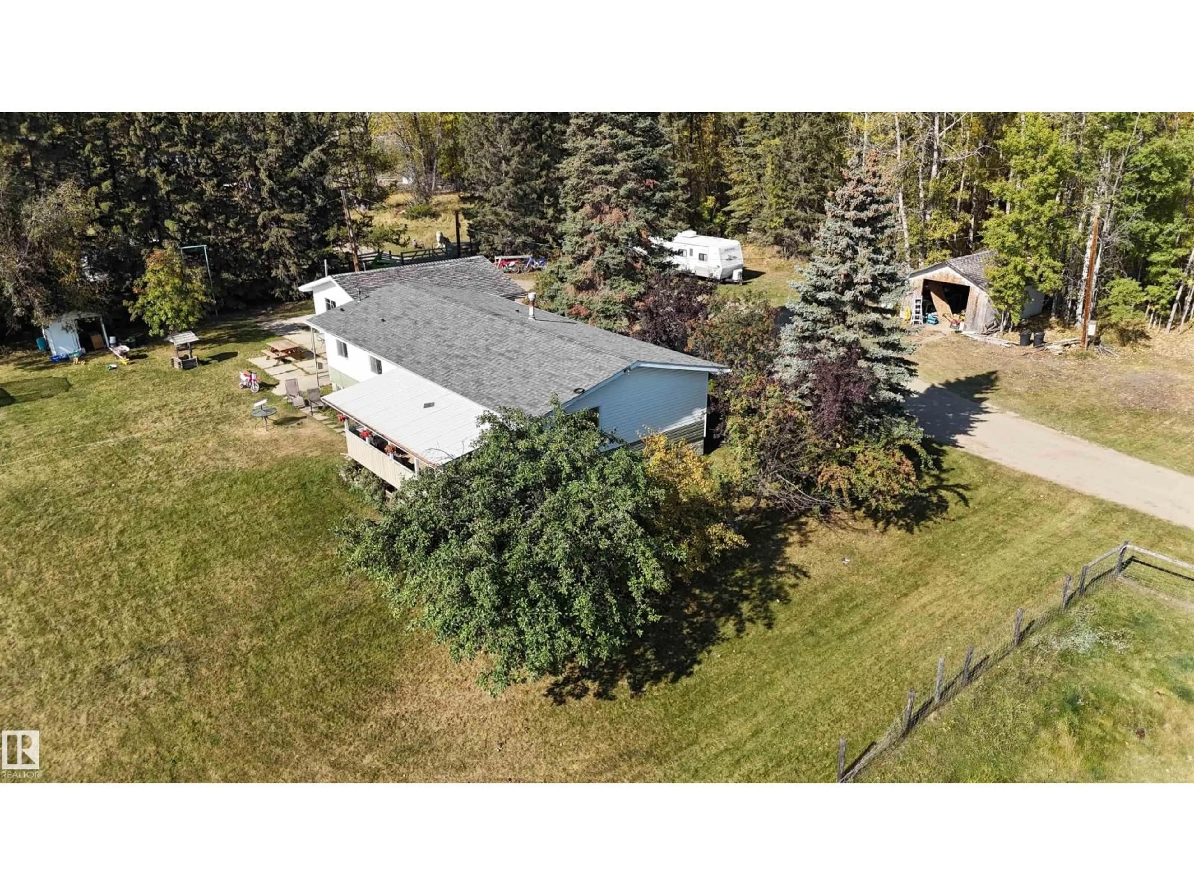 A pic from outside/outdoor area/front of a property/back of a property/a pic from drone, unknown for 49308 RR 75, Drayton Valley Alberta T7A2A3