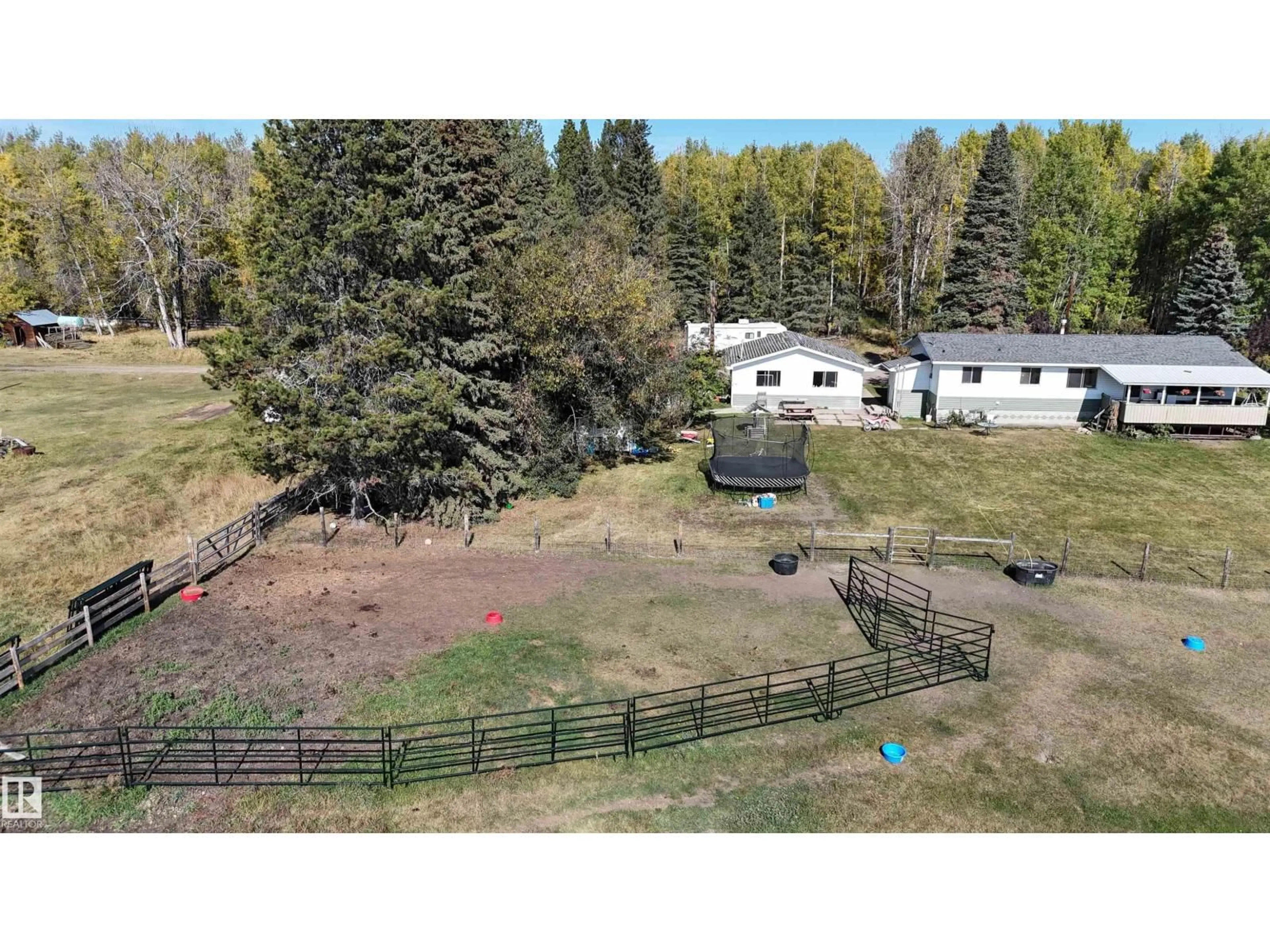 A pic from outside/outdoor area/front of a property/back of a property/a pic from drone, mountain view for 49308 RR 75, Drayton Valley Alberta T7A2A3