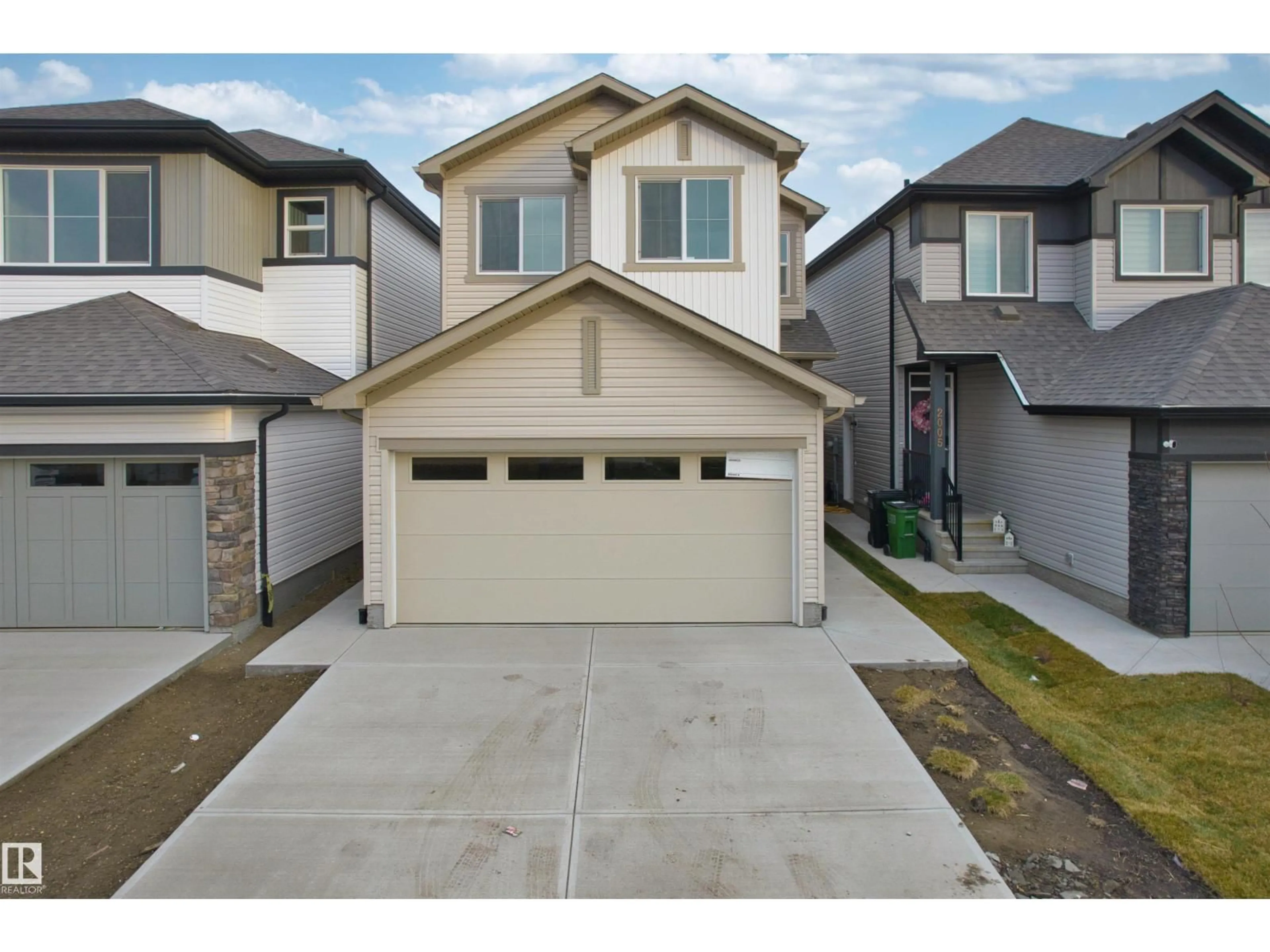 Home with vinyl exterior material, street for 2009 209A ST, Edmonton Alberta T6M3C8