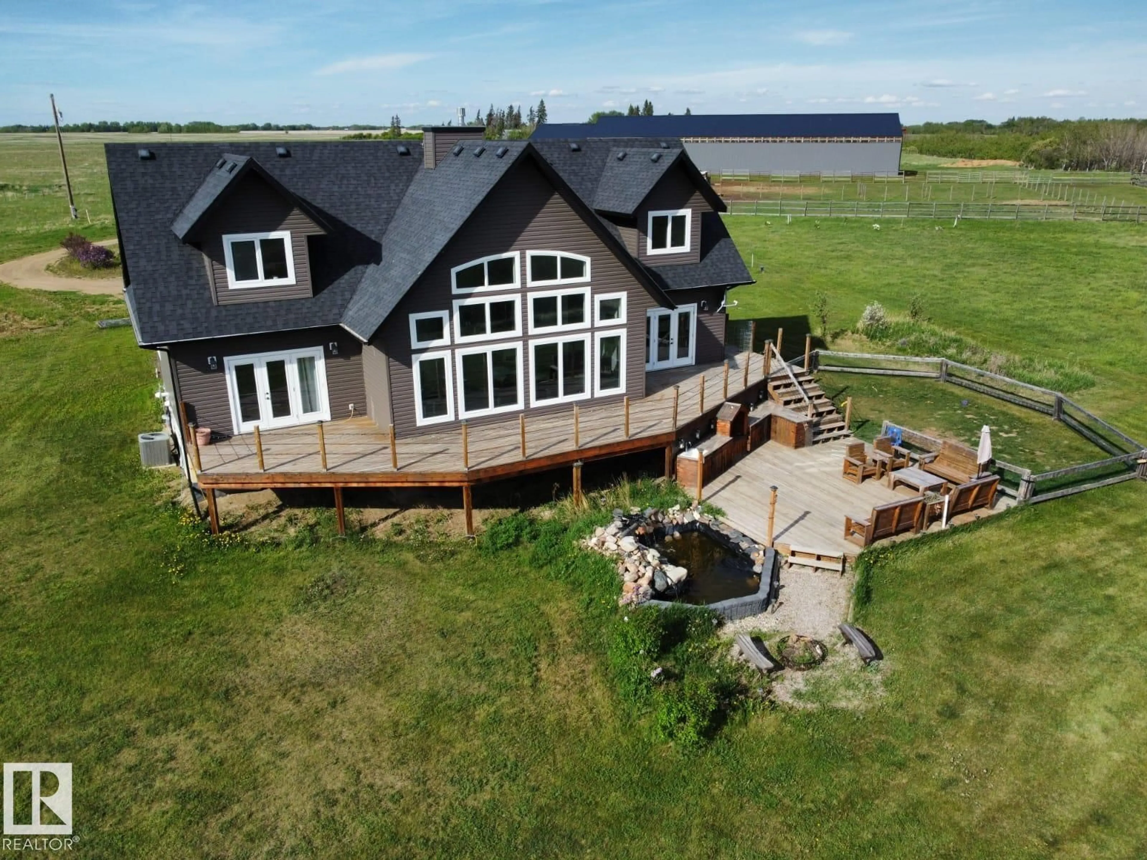 A pic from outside/outdoor area/front of a property/back of a property/a pic from drone, water/lake/river/ocean view for 20213 TOWNSHIP ROAD 460, Rural Camrose County Alberta T4V2M9