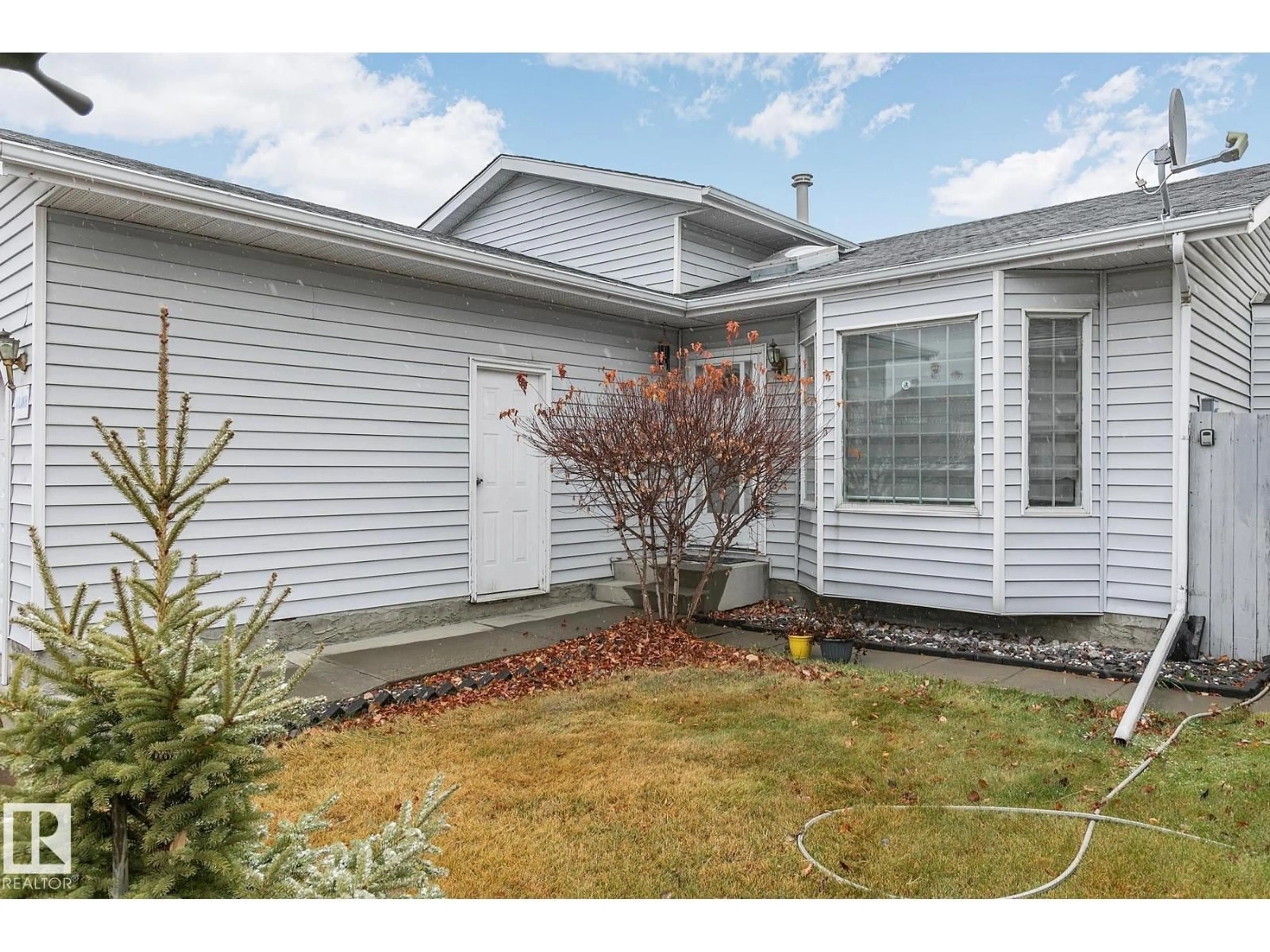 Home with vinyl exterior material, street for 14523 32 ST, Edmonton Alberta T5Y2L2