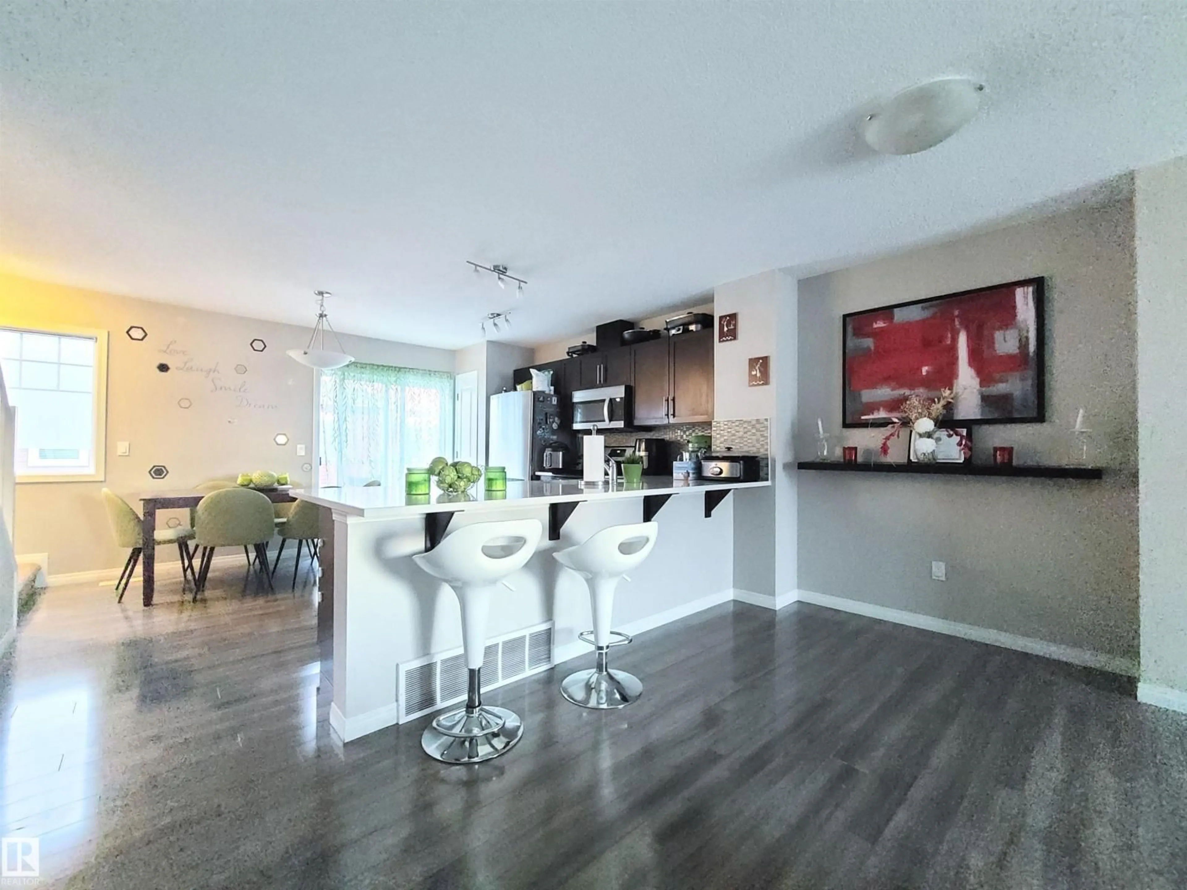 Open concept kitchen, wood/laminate floor for 448 HEMMINGWAY RD, Edmonton Alberta T6M0M5
