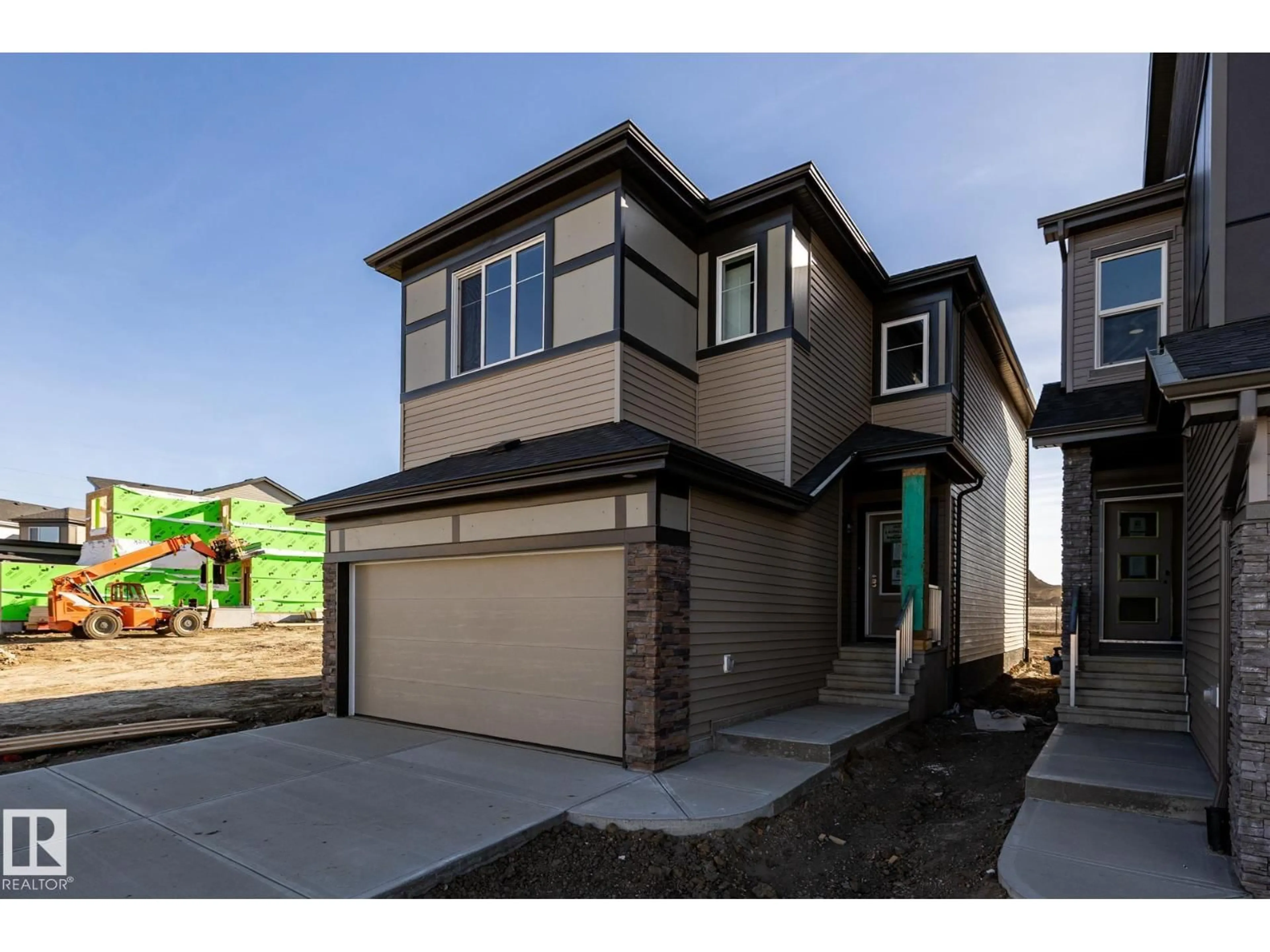 Home with brick exterior material, street for 2631 5 AV, Edmonton Alberta T6X3J1