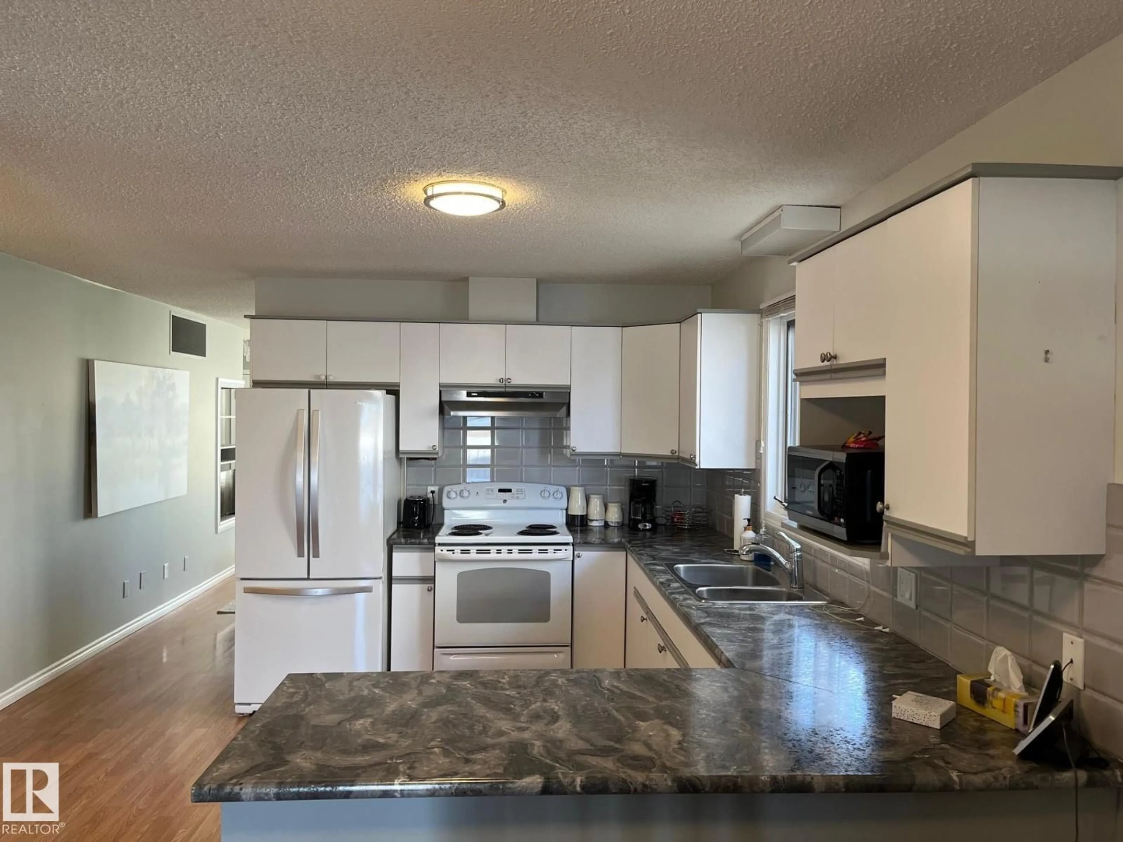 Open concept kitchen, unknown for 32 11015 105 AV, Westlock Alberta T7P1A1