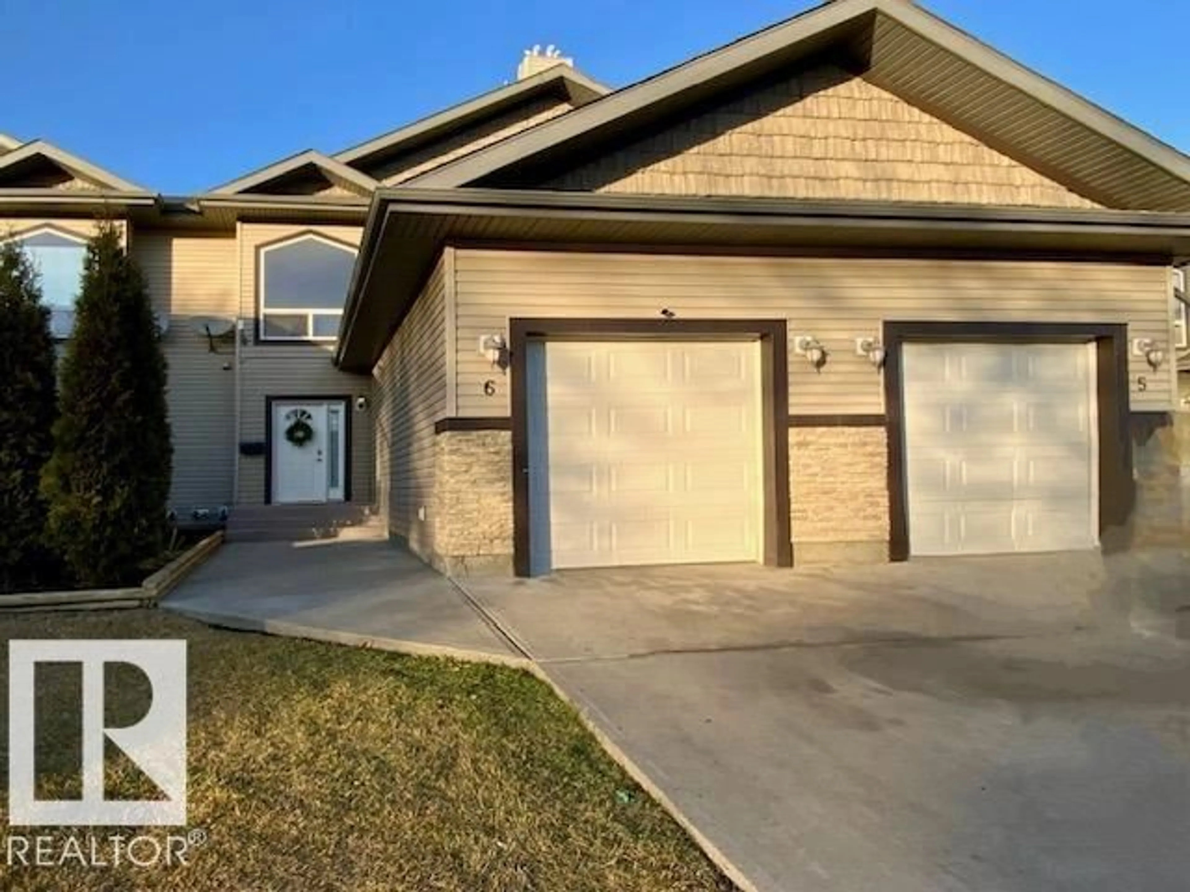 Home with vinyl exterior material, street for B - 4706 57 AV, Wetaskiwin Alberta T9A3S9