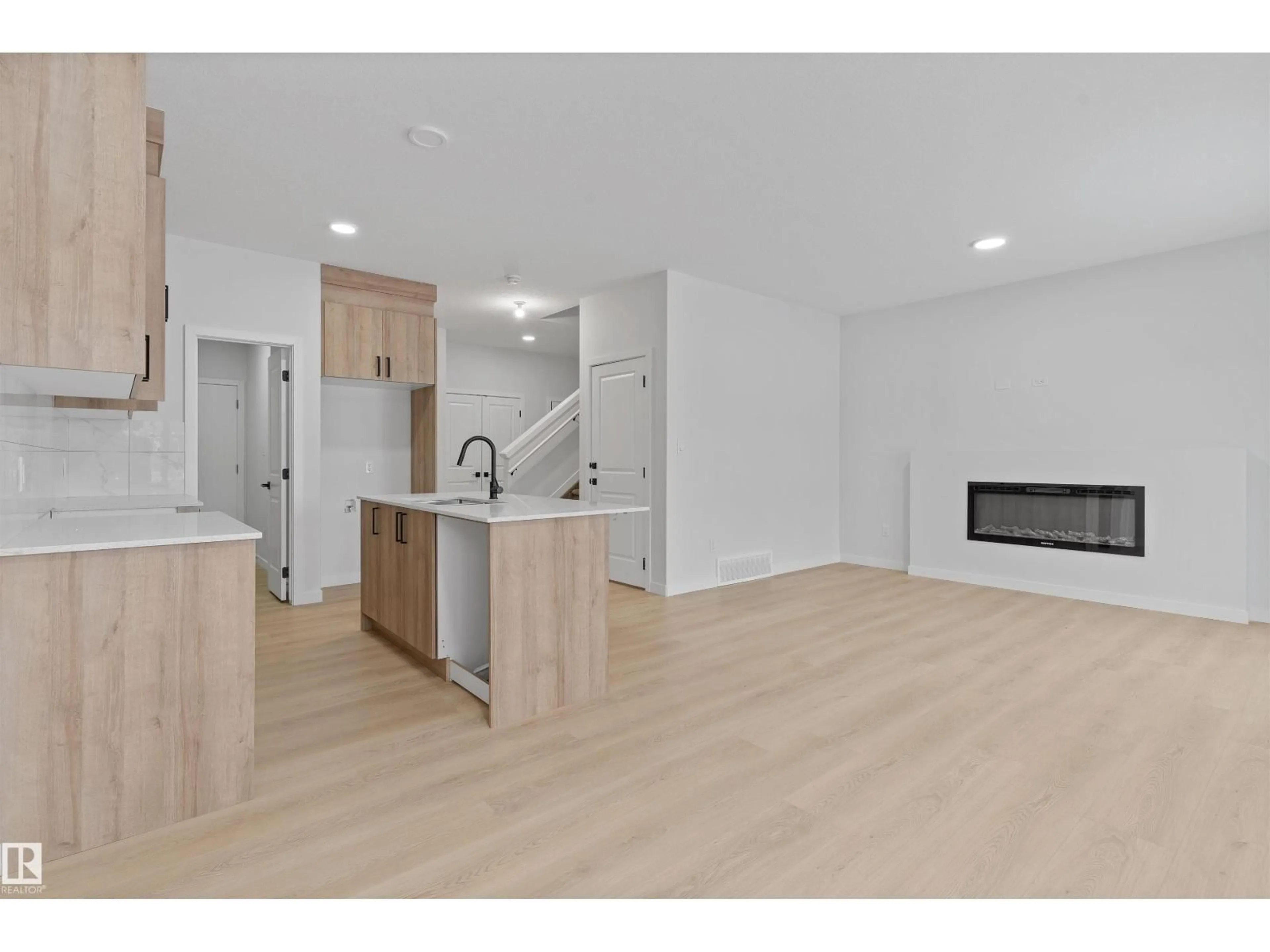 Open concept kitchen, wood/laminate floor for SW - 6385 KING WD, Edmonton Alberta T6W5J3