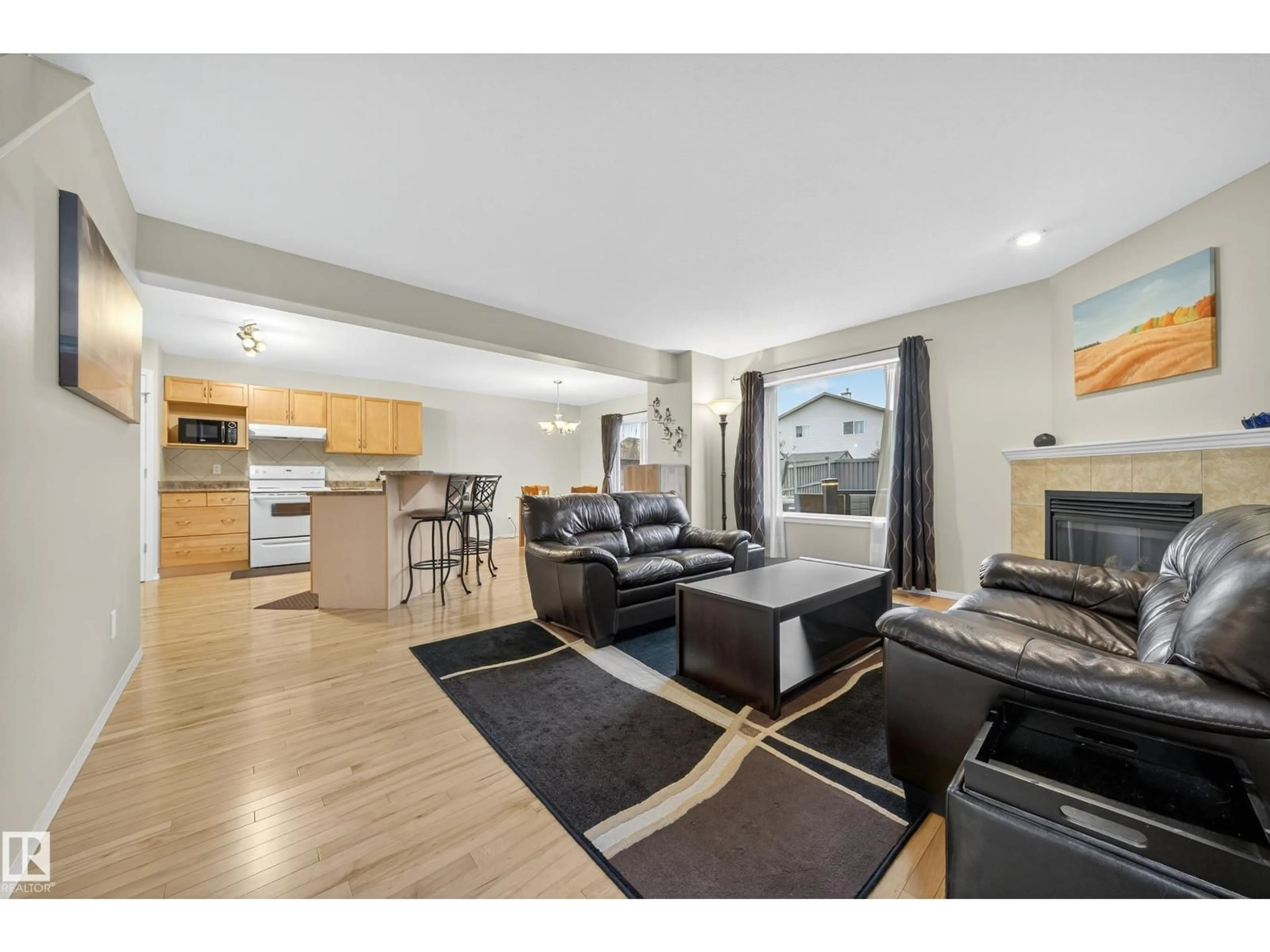 Open concept kitchen, wood/laminate floor for 4712 204 STREET, Edmonton Alberta T6M0C3