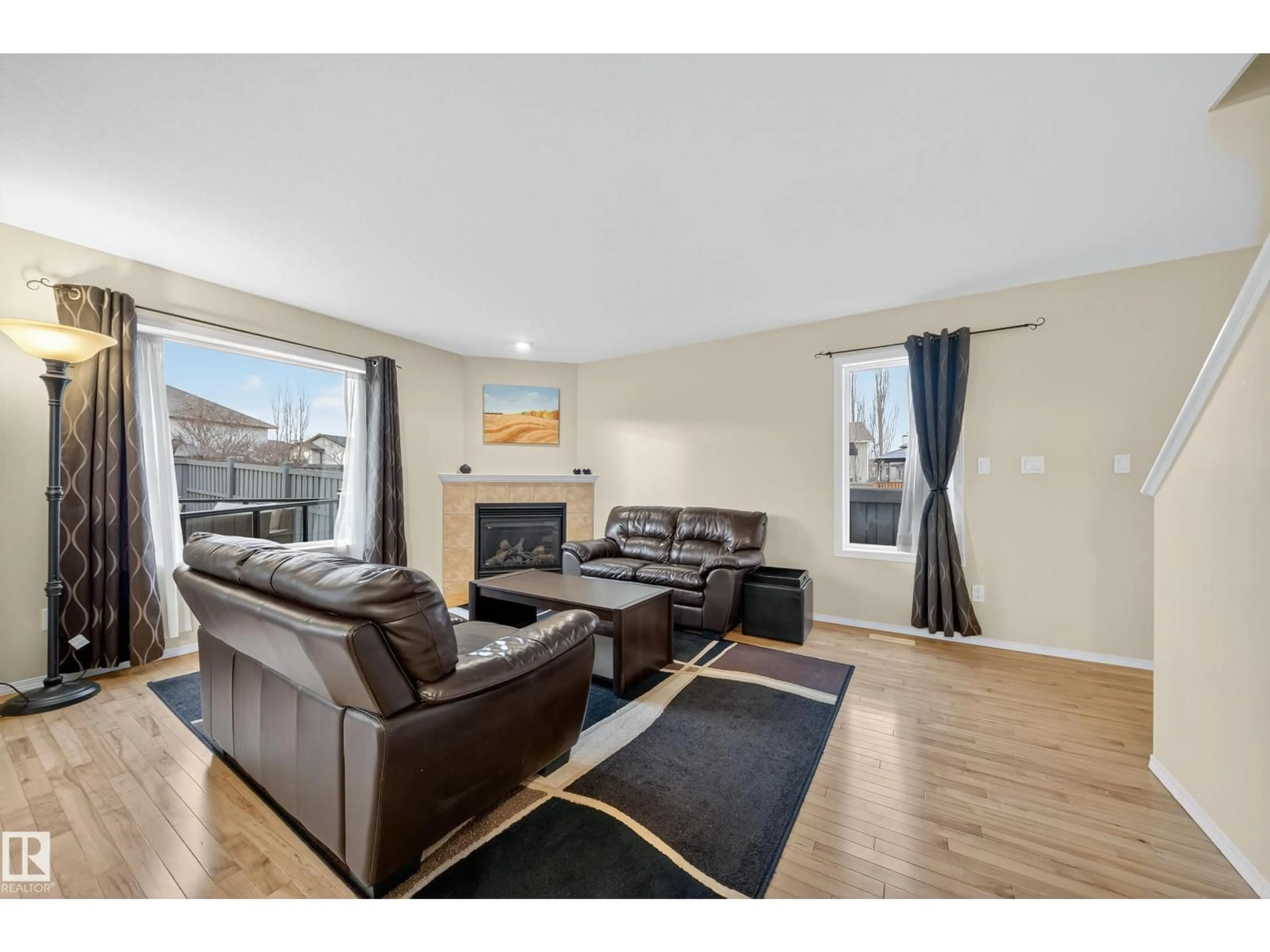 Living room with furniture, wood/laminate floor for 4712 204 STREET, Edmonton Alberta T6M0C3