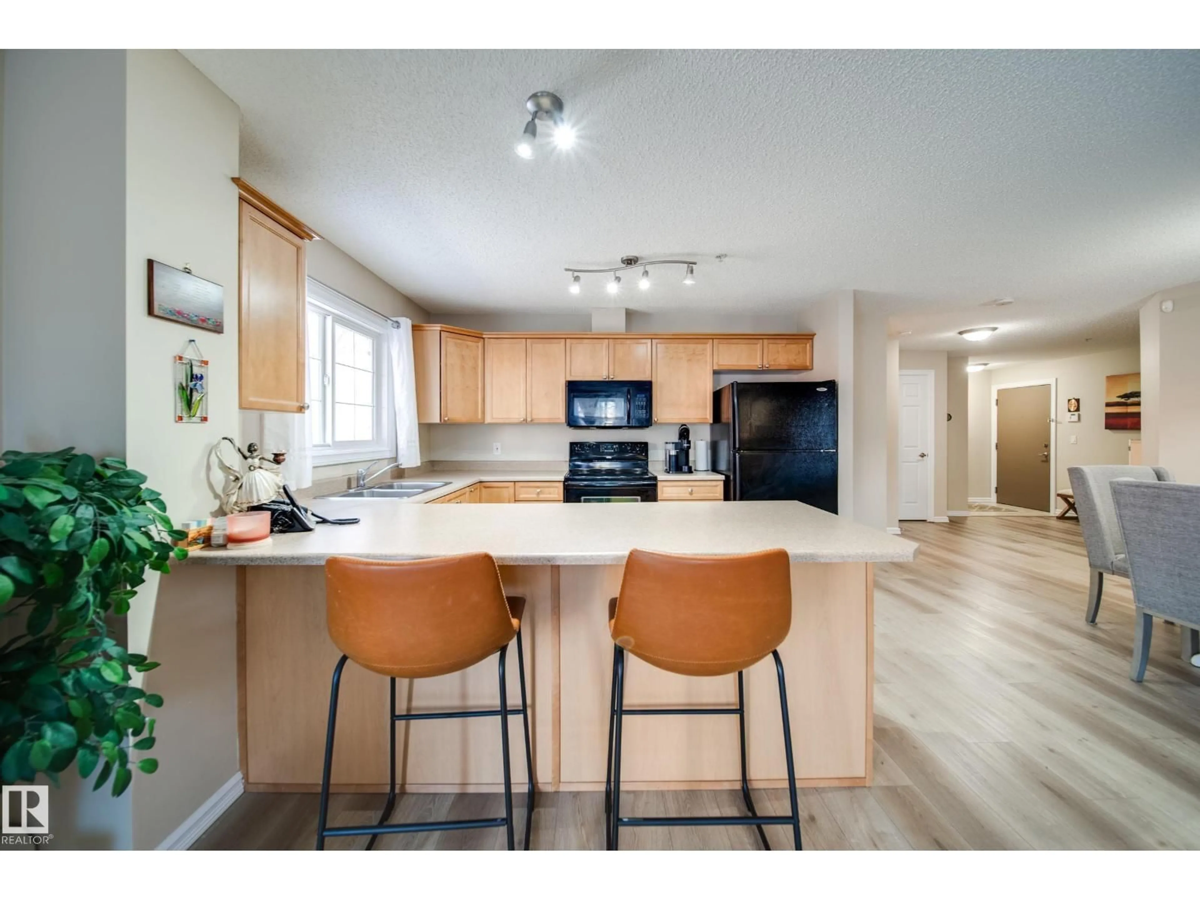 Open concept kitchen, unknown for #115 - 4403 23 ST, Edmonton Alberta T6T0E4