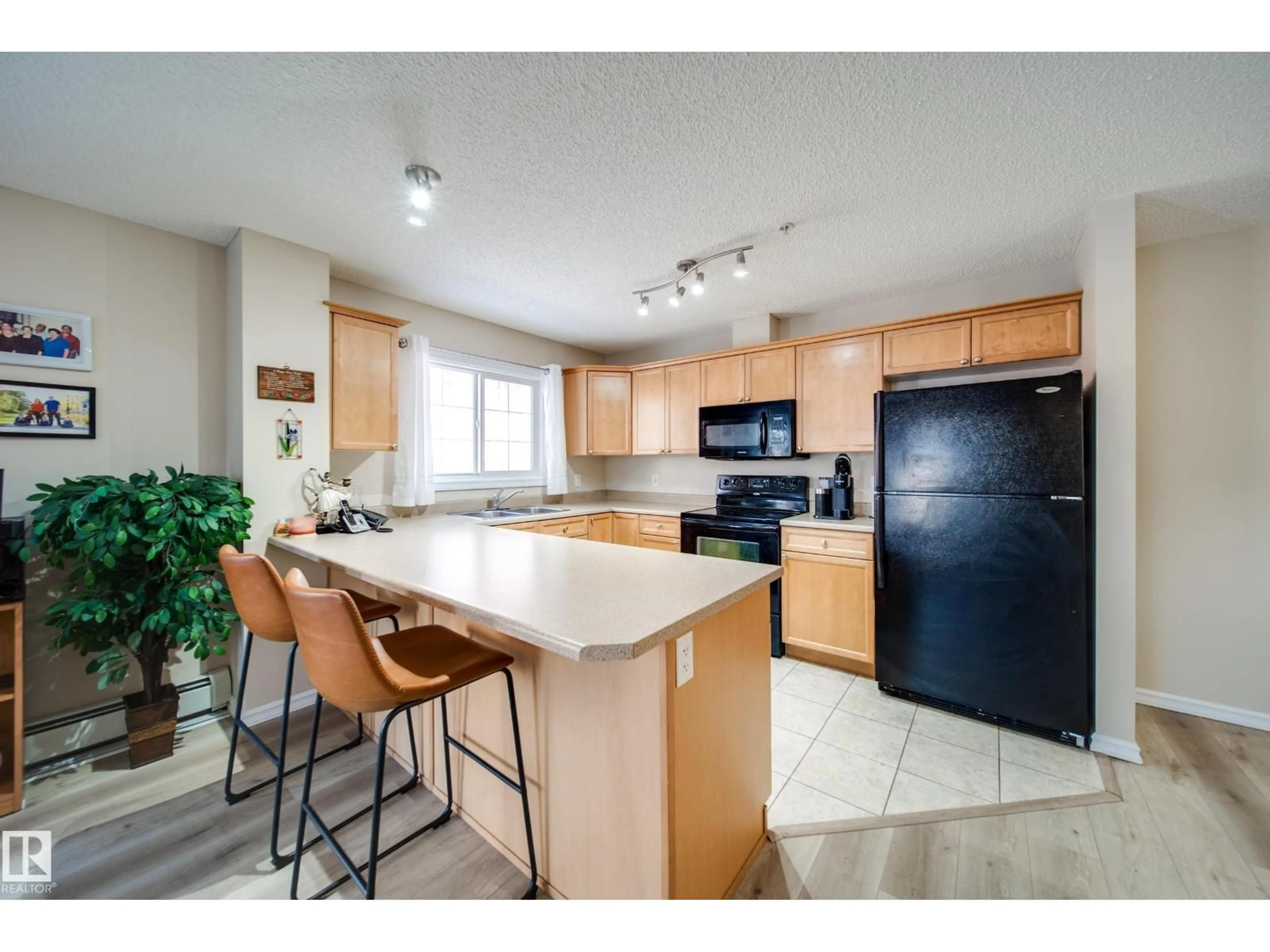 Open concept kitchen, unknown for #115 - 4403 23 ST, Edmonton Alberta T6T0E4