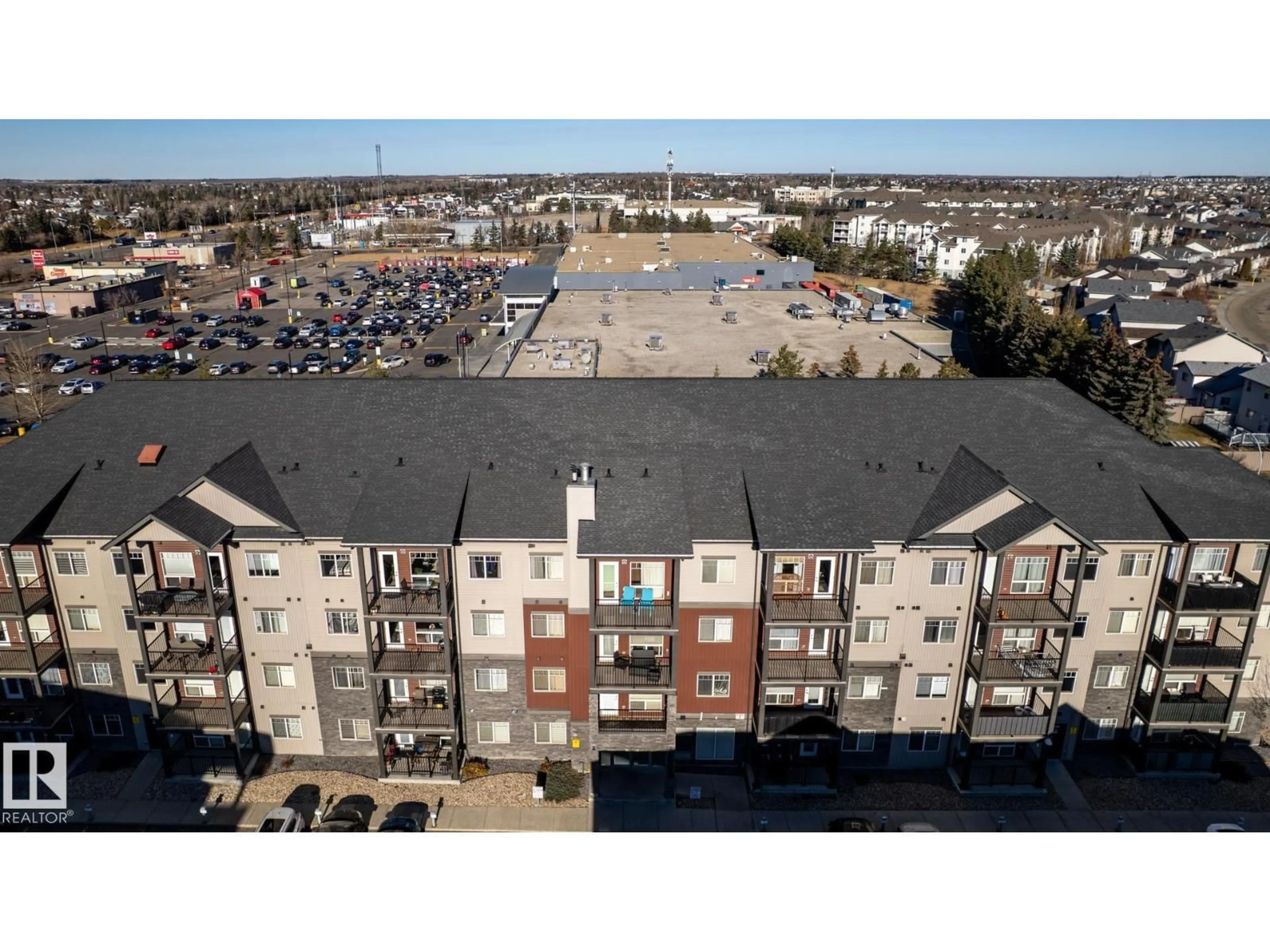 A pic from outside/outdoor area/front of a property/back of a property/a pic from drone, building for 108 - 9523 160 AV, Edmonton Alberta T5Z0N1