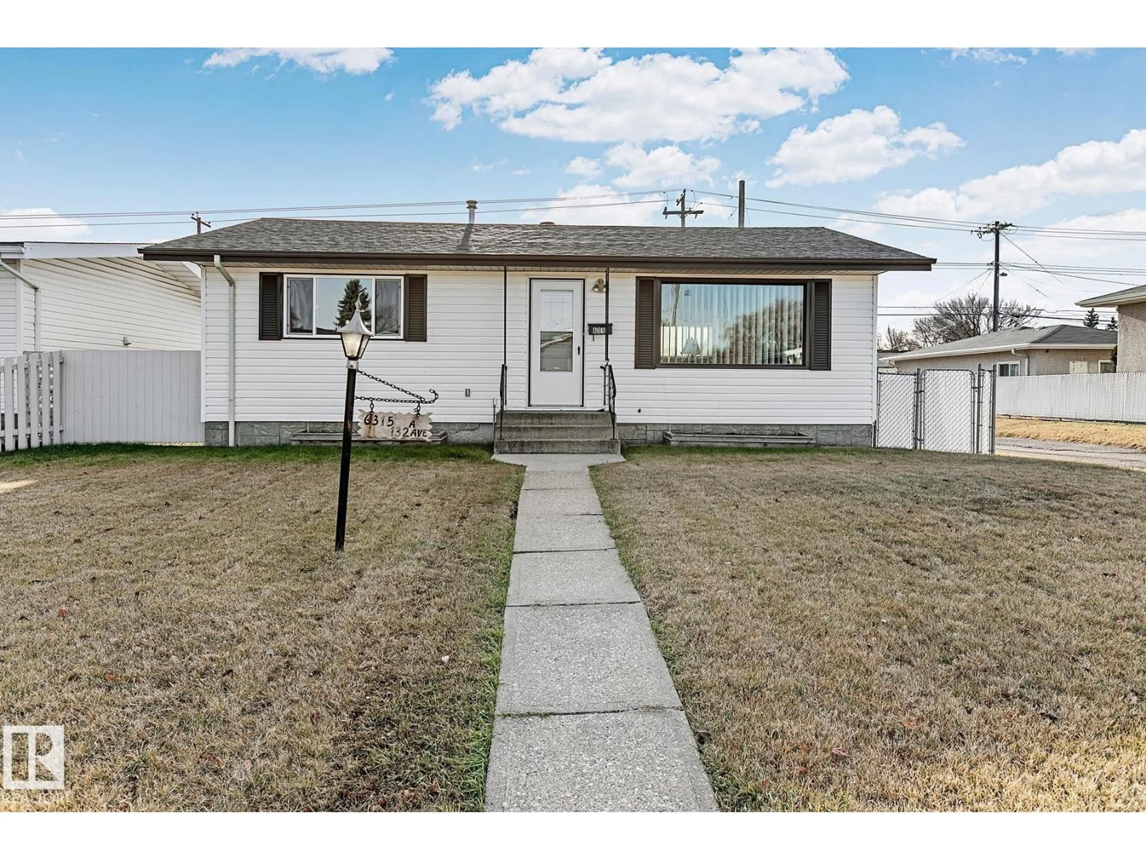 Home with vinyl exterior material, street for 6315 132A AV, Edmonton Alberta T5A0J9