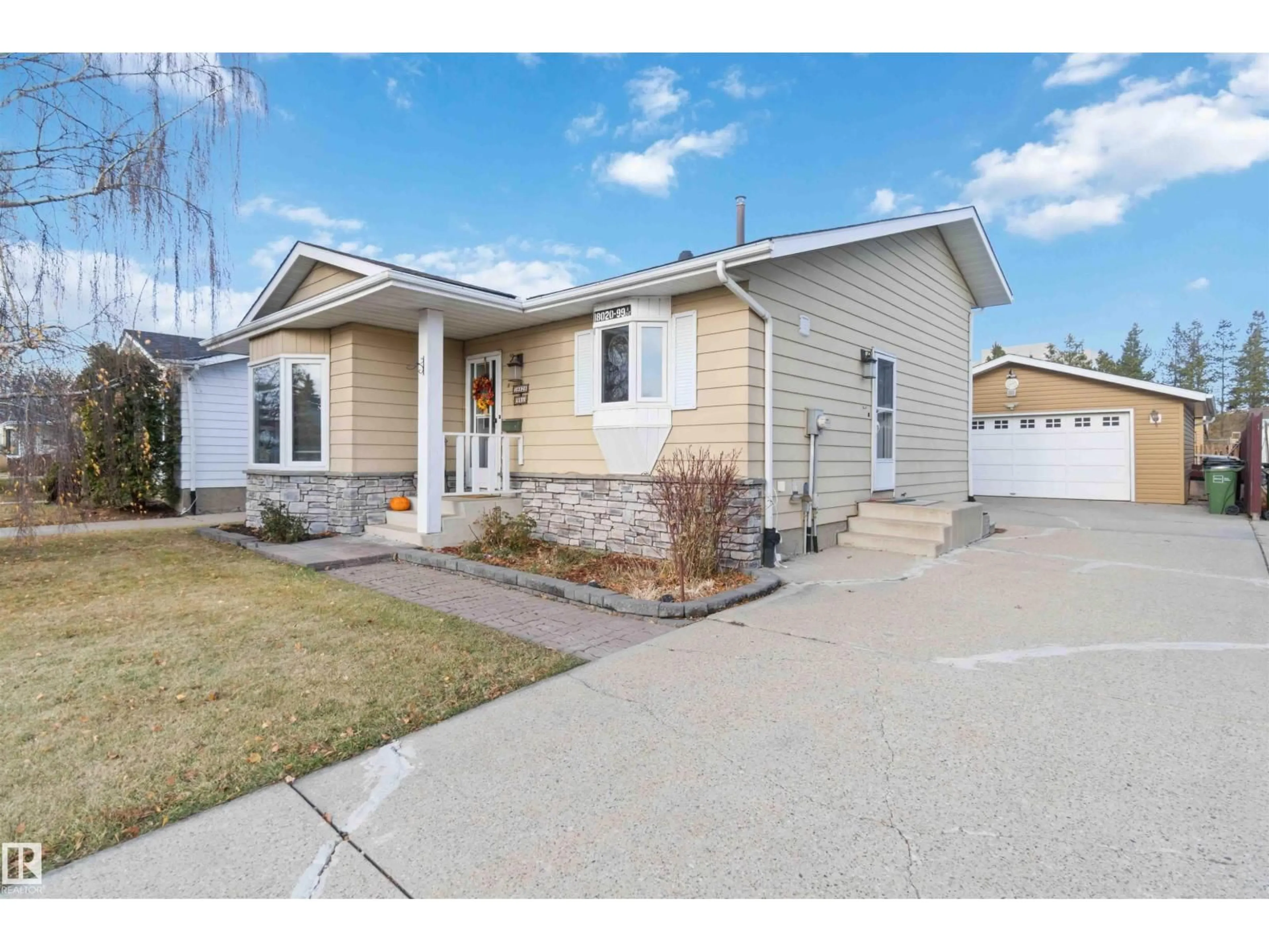 Home with vinyl exterior material, street for 18020 99A AV, Edmonton Alberta T5T3R1