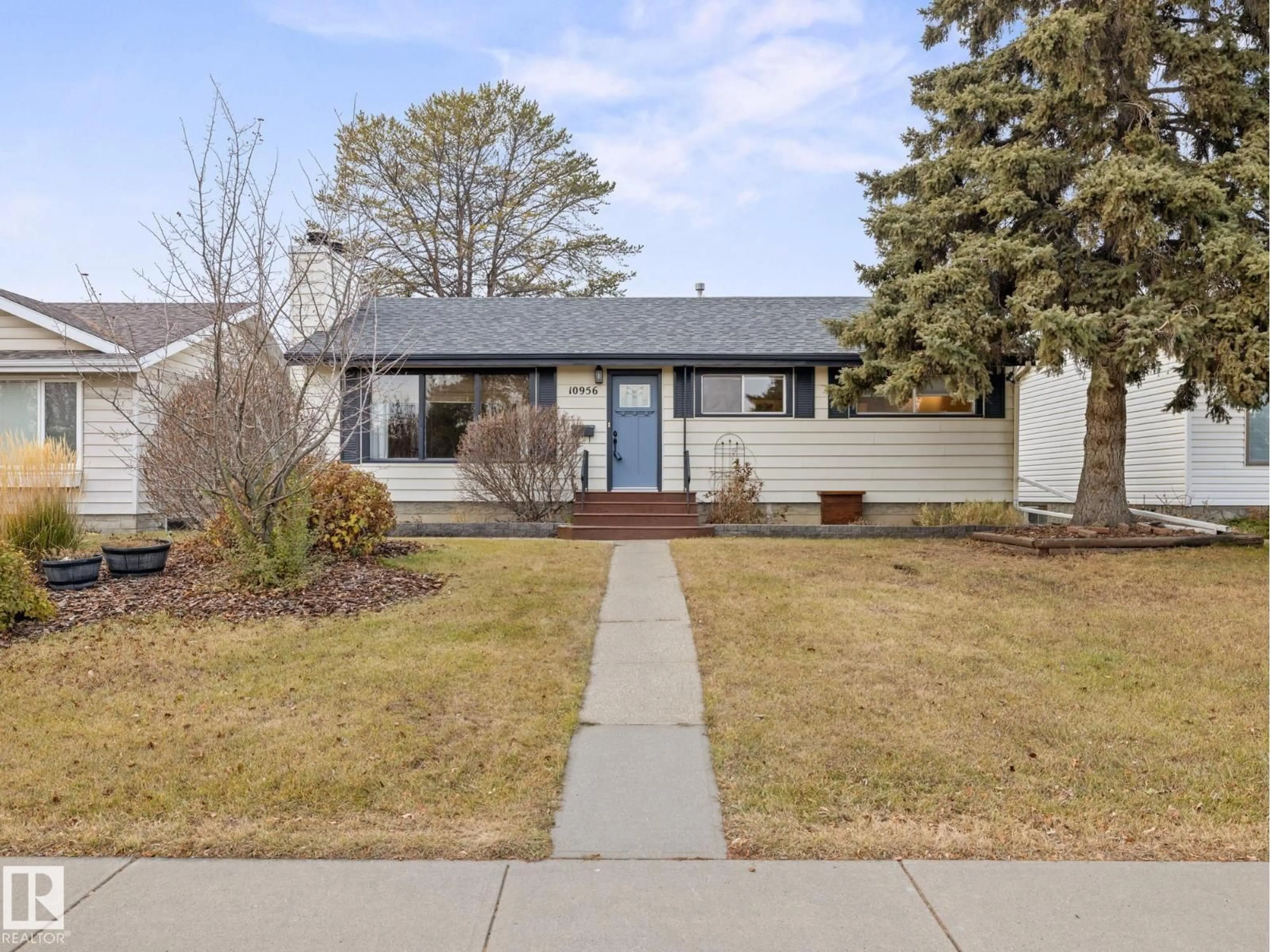 Home with vinyl exterior material, street for NW - 10956 164 ST, Edmonton Alberta T5P3S3