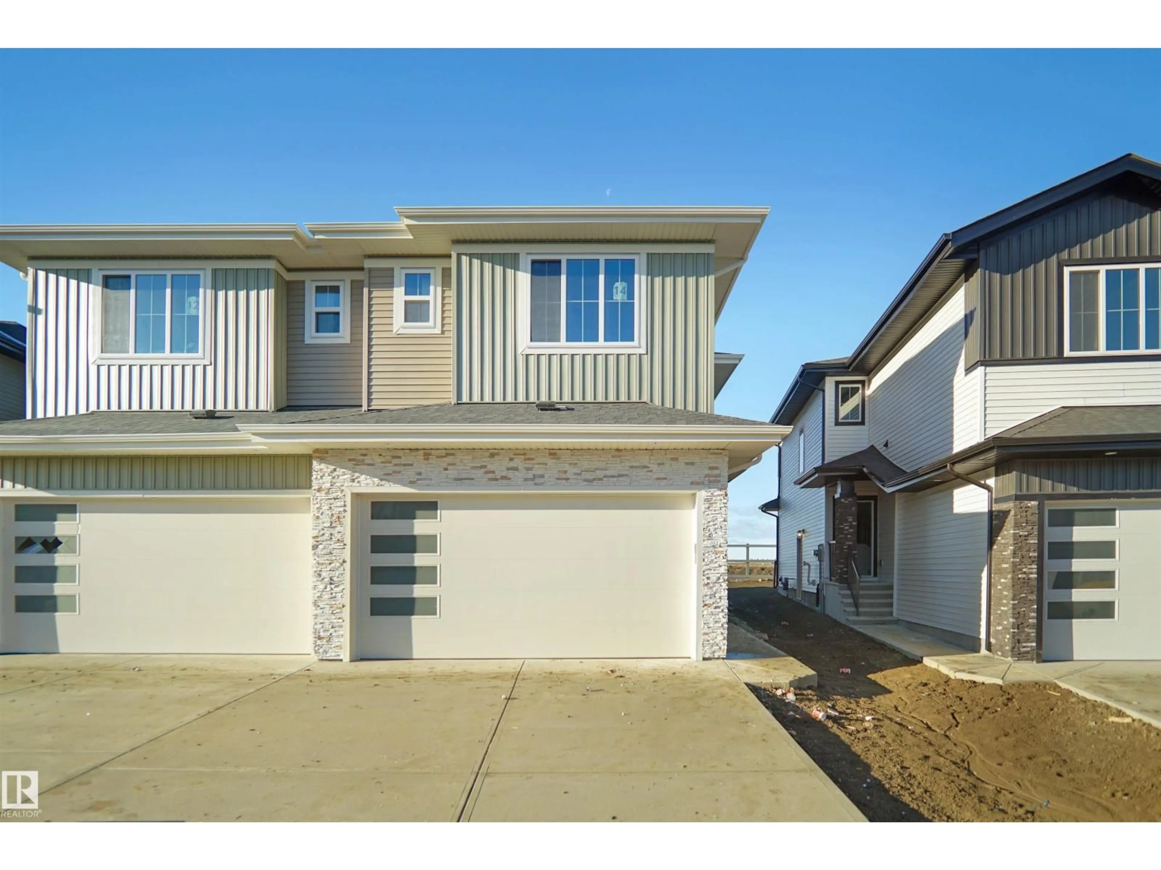 Home with vinyl exterior material, street for 14 AXELWOOD CR, Spruce Grove Alberta T7X4G4
